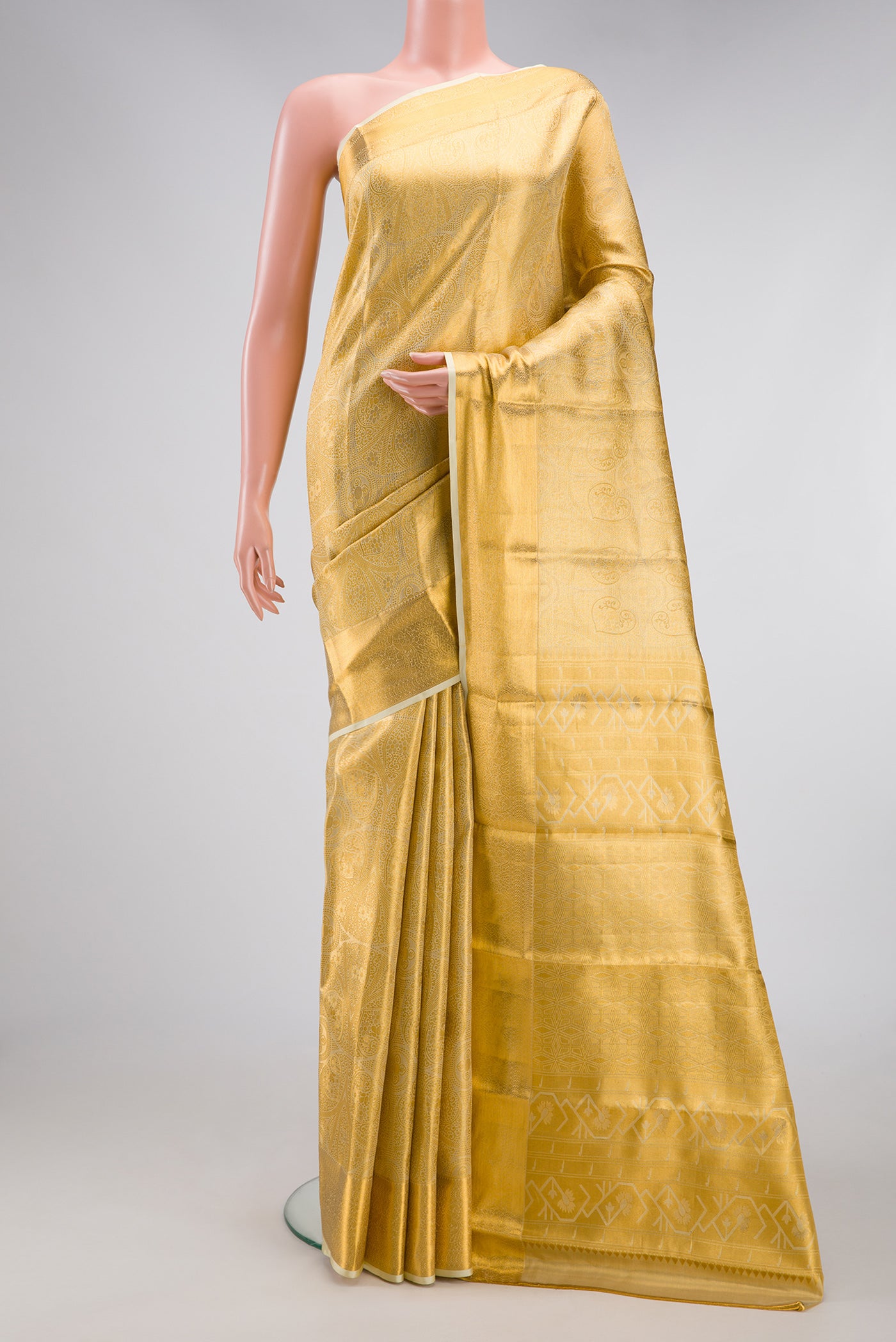 Gold Dual Tone Kanchipuram Tissue Silk Saree with Zari Brocade on the body and Zari Border.  displayed on a mannequin