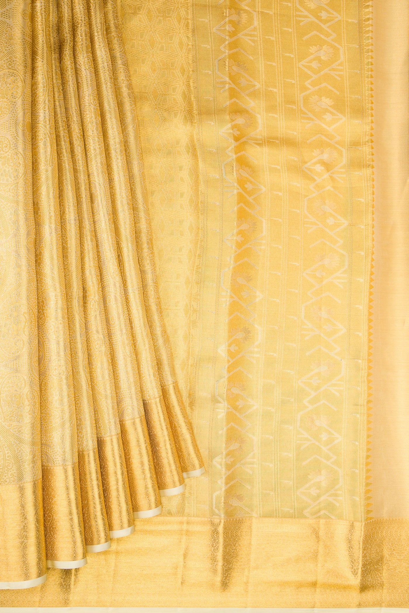 Pleats and pallu of Gold Dual Tone Kanchipuram Tissue Silk Saree with Zari Brocade on the body and Zari Border. 