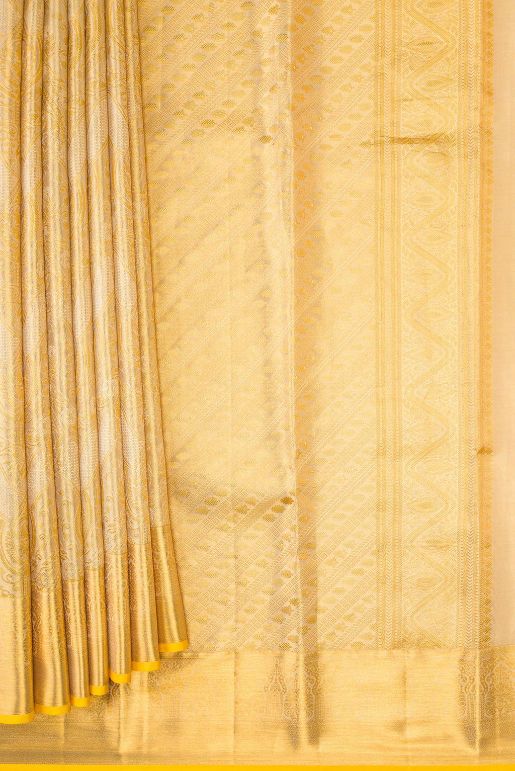 Pleats and pallu of Gold Dual Tone Kanchipuram Tissue Silk Saree with Zari Brocade on the body and Zari Border. 