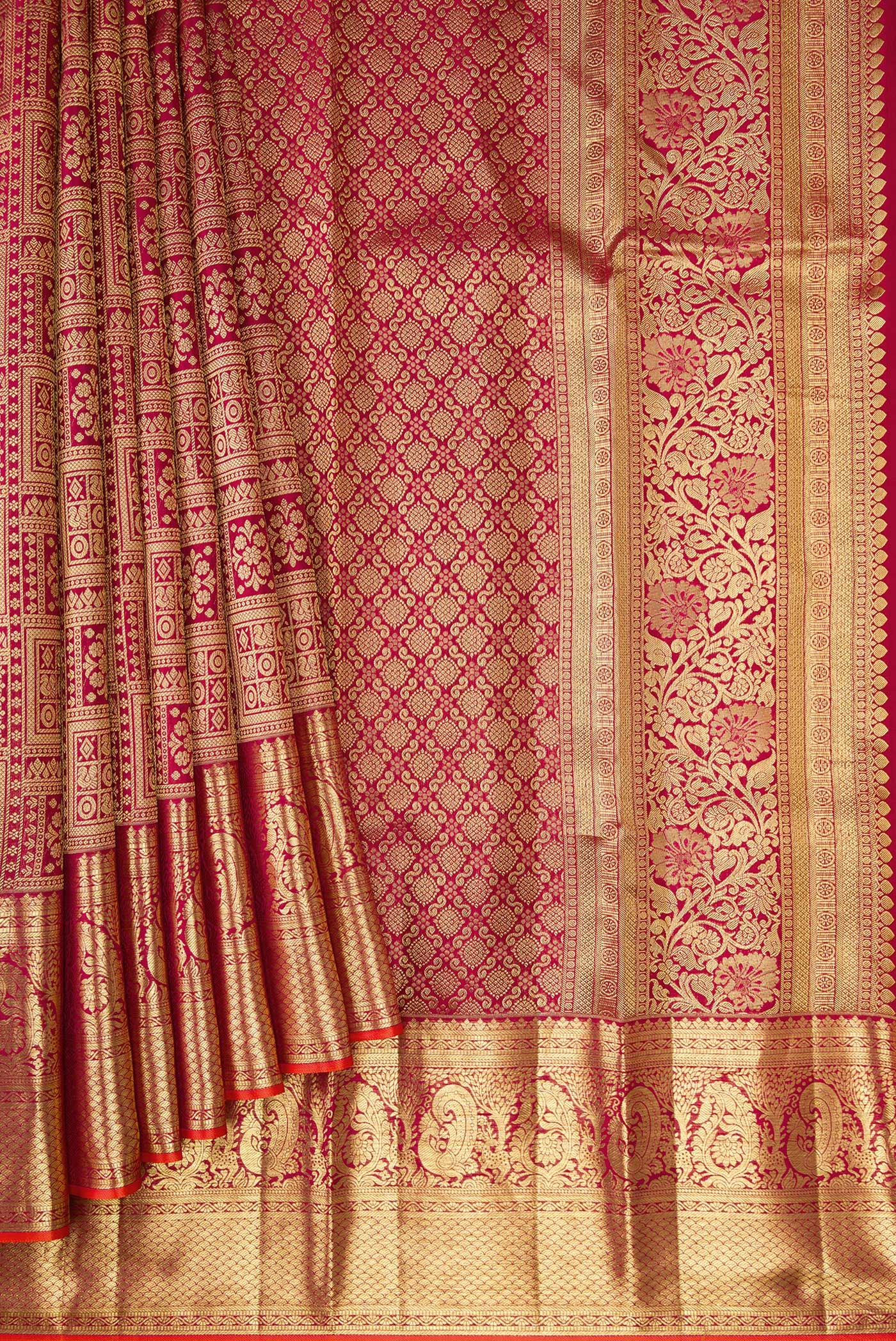 Pleats and pallu of Maroon Kanjivaram Silk Saree with Zari Brocade on the body and Zari Border. 