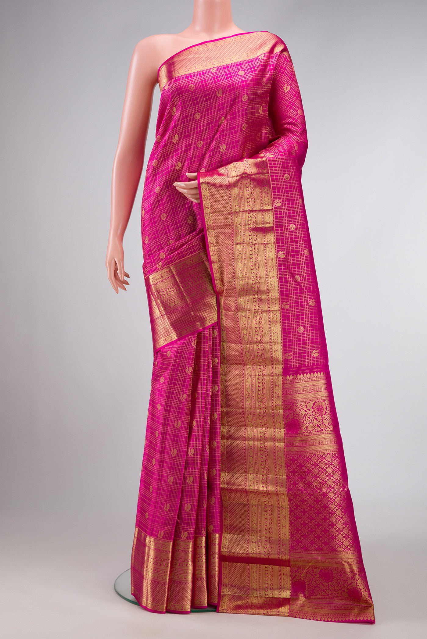 Pink Dual Tone Kanjivaram Silk Saree with Checked design on the body and Zari Border.  displayed on a mannequin