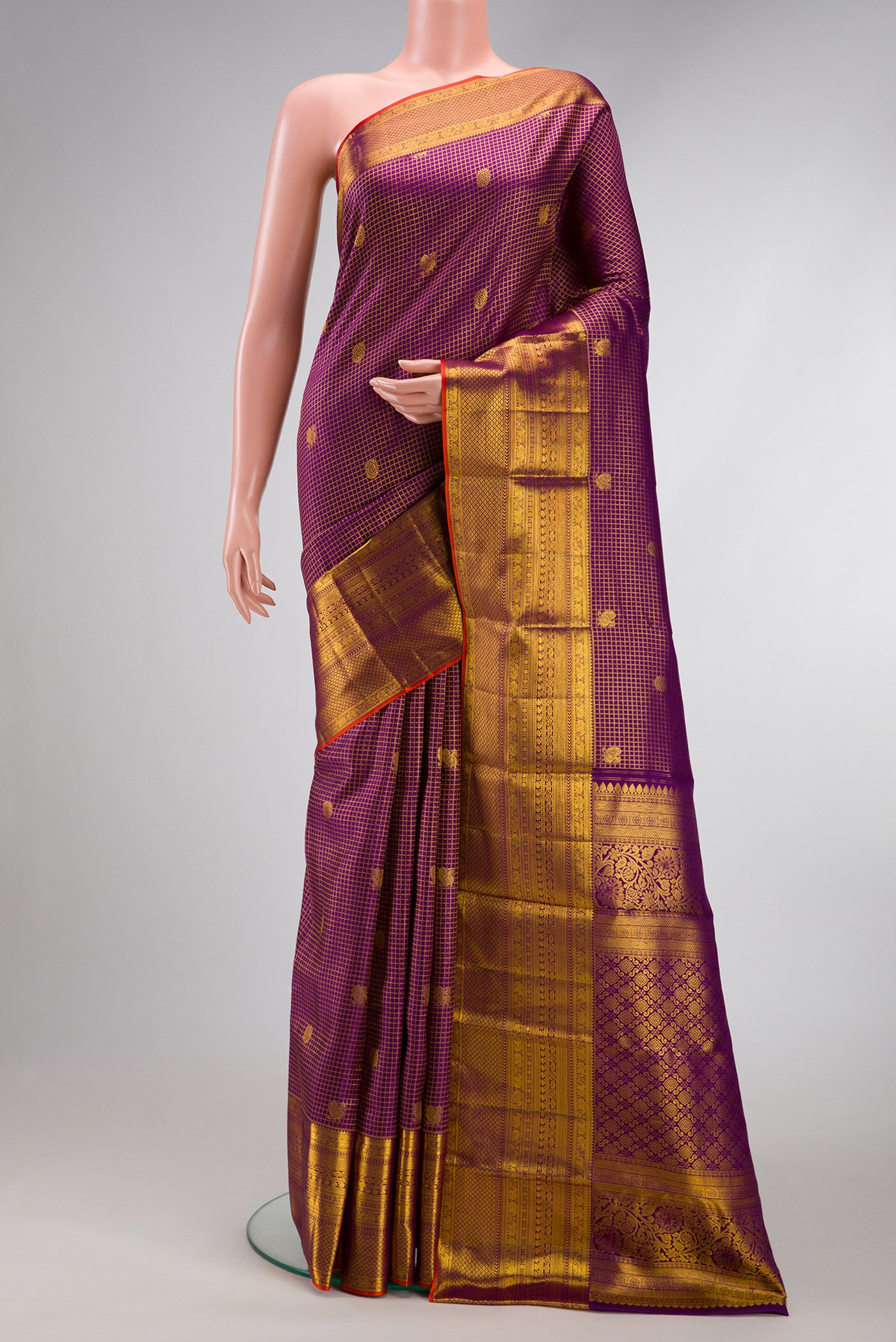 Violet Dual Tone Kanjivaram Silk Saree with Checked design on the body and Zari Border.  displayed on a mannequin