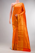 Pure Silk Orange Kanjivaram Saree with Zari Brocade on the body and Zari Border.  displayed on a mannequin