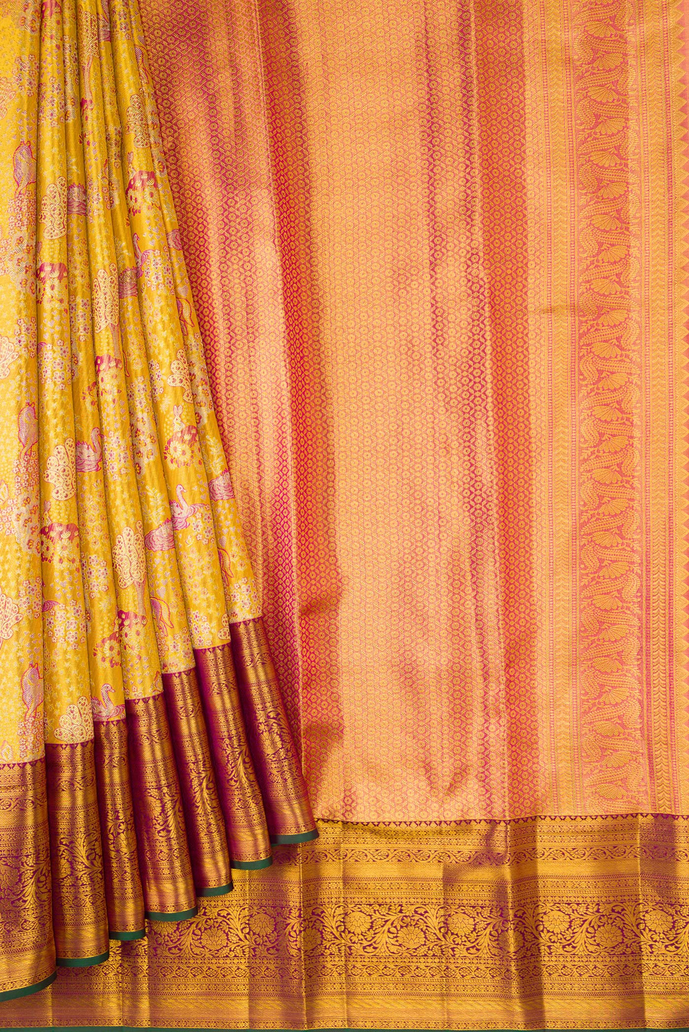 Pleats and pallu of Gold Dual Tone Kanjivaram Tissue Silk Saree with Zari Brocade on the body and Zari Border. 