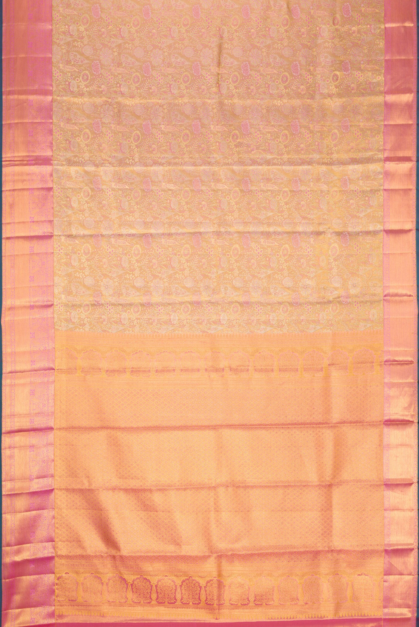 Flat view of Gold Dual Tone Kanjivaram Tissue Silk Saree with Zari Brocade on the body and Zari Border. 