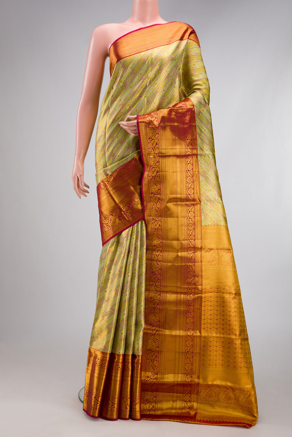 Green Dual Tone Kanjivaram Tissue Silk Saree with Zari Brocade on the body and Fancy Border.  displayed on a mannequin