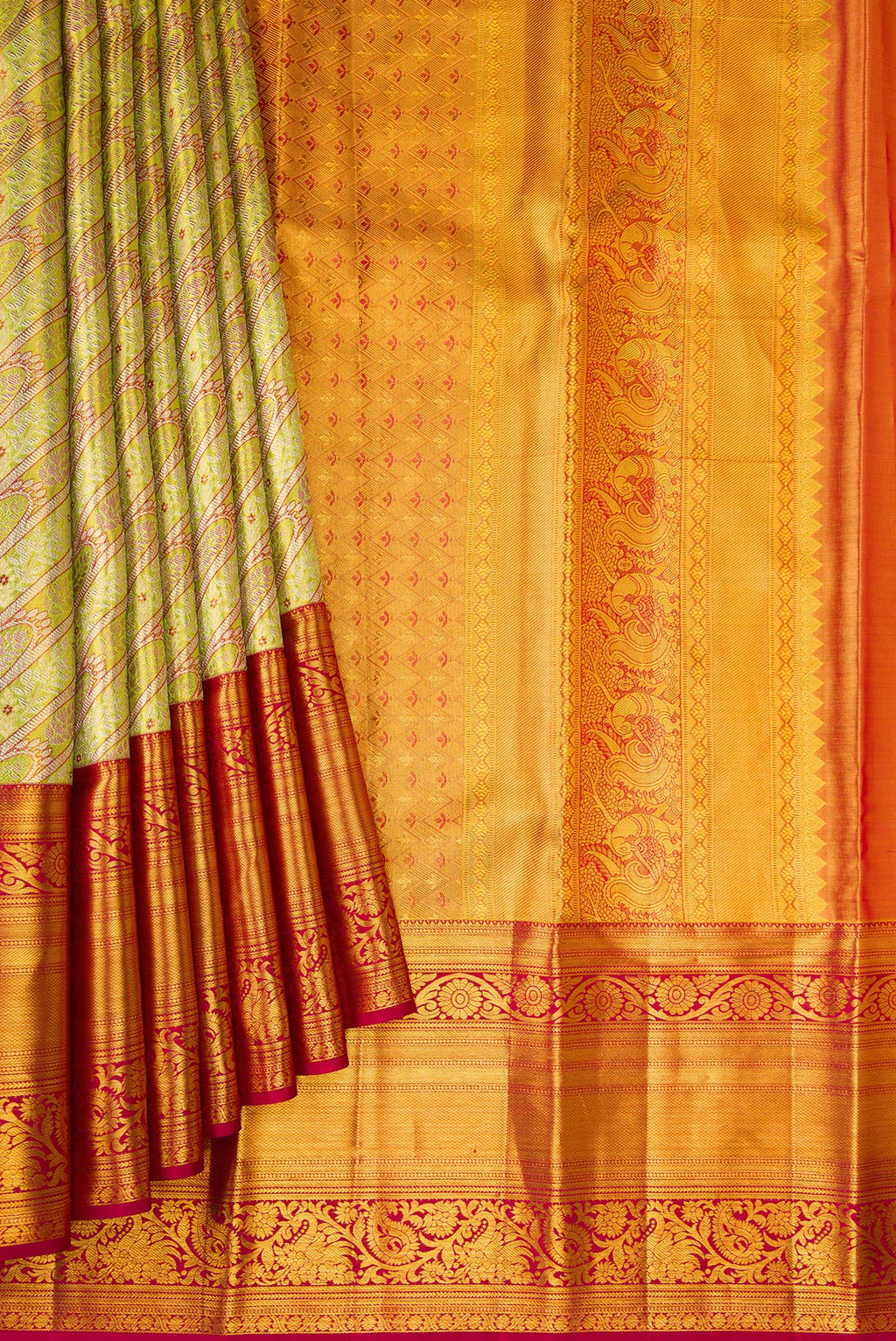 Pleats and pallu of Green Dual Tone Kanjivaram Tissue Silk Saree with Zari Brocade on the body and Fancy Border. 