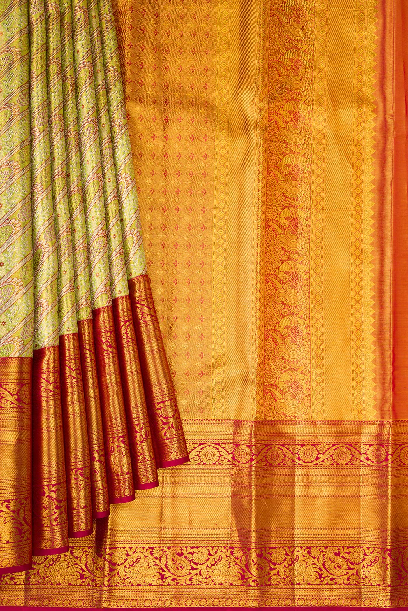 Pleats and pallu of Green Dual Tone Kanjivaram Tissue Silk Saree with Zari Brocade on the body and Fancy Border. 