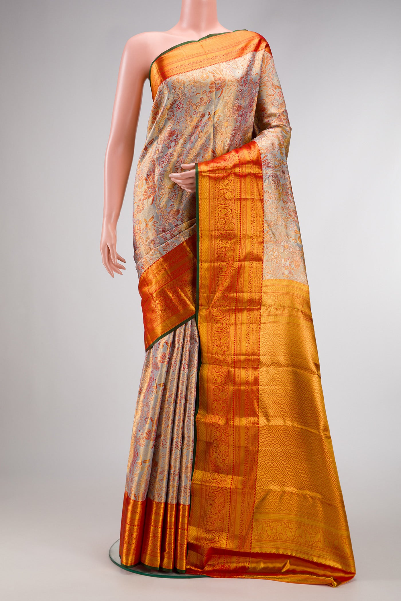 Light Blue Dual Tone Kanjivaram Tissue Silk Saree with Zari Brocade on the body and Zari Border.  displayed on a mannequin