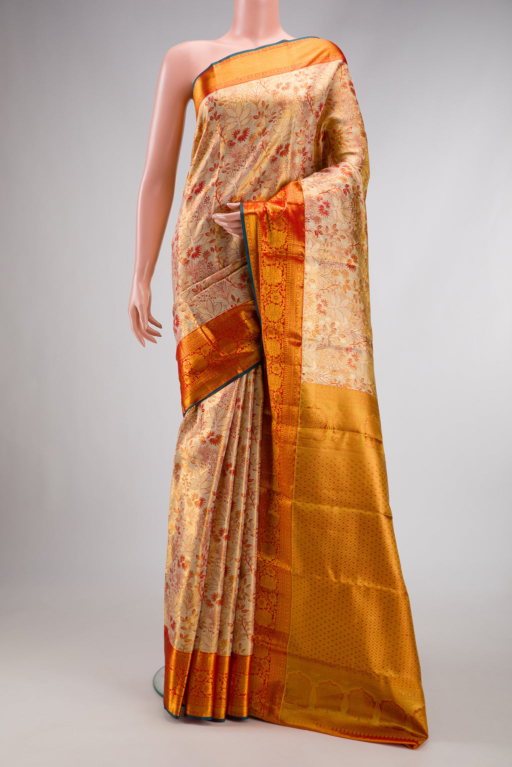 Gold Dual Tone Kanjivaram Tissue Silk Saree with Zari Brocade on the body and Zari Border.  displayed on a mannequin