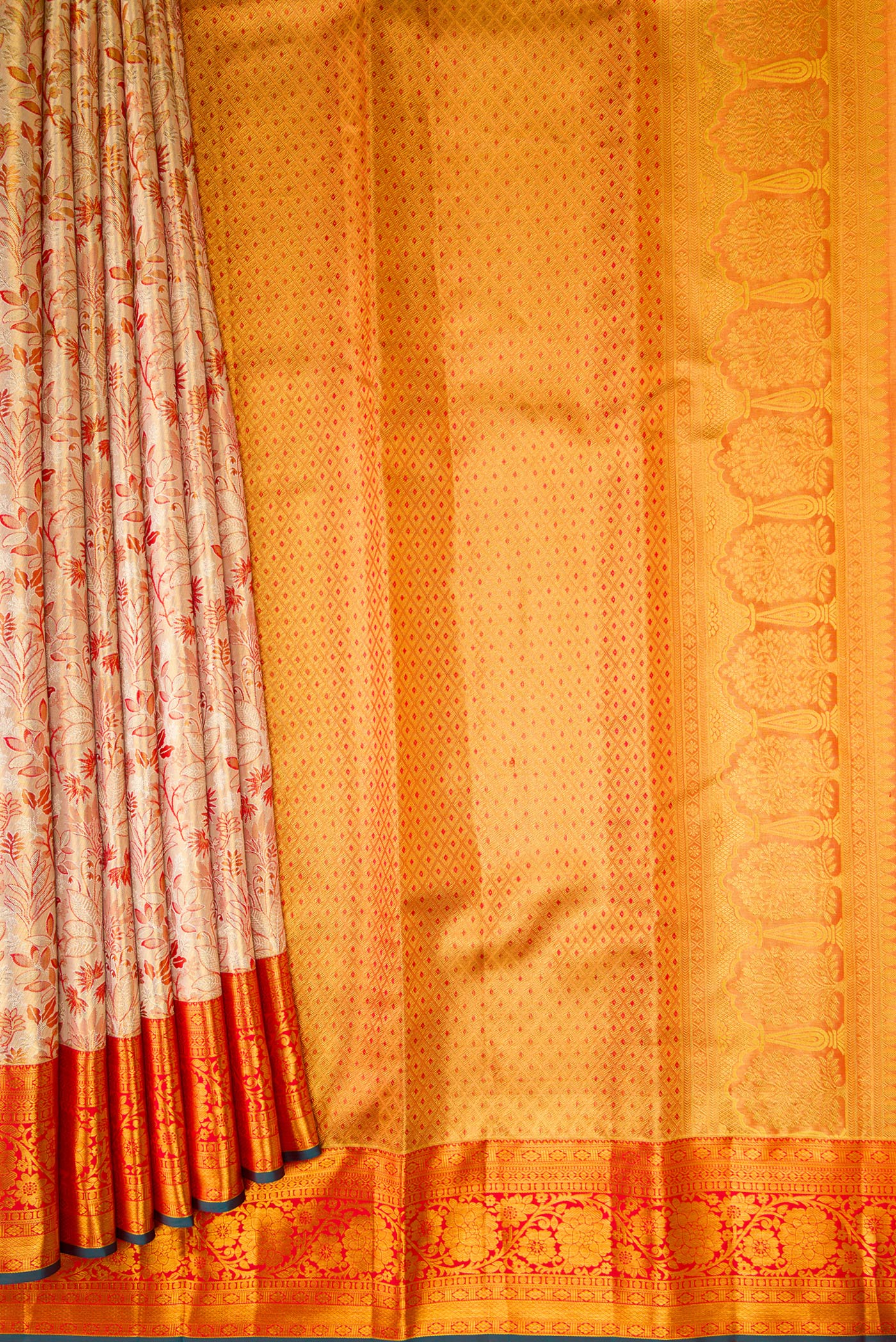 Pleats and pallu of Gold Dual Tone Kanjivaram Tissue Silk Saree with Zari Brocade on the body and Zari Border. 