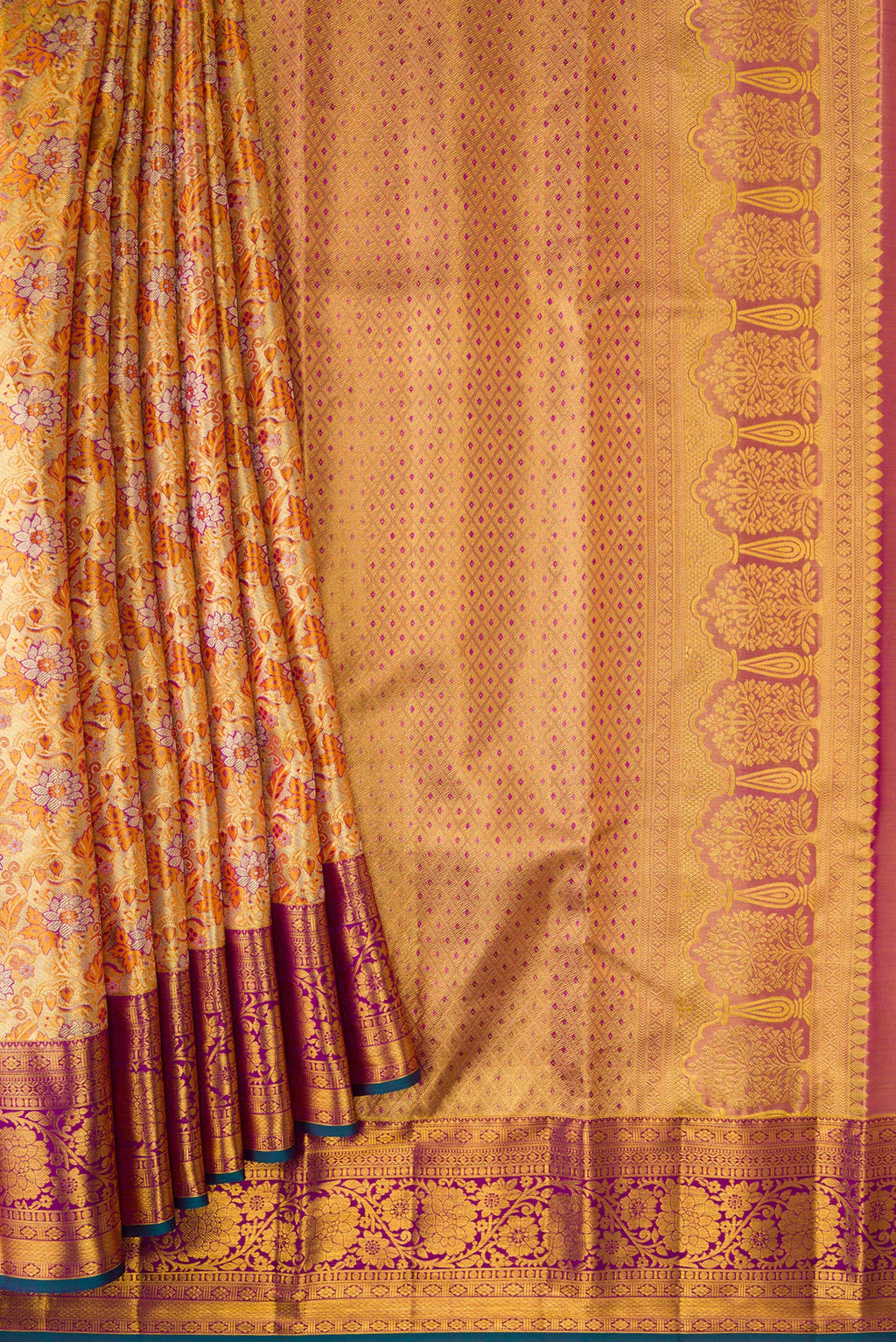 Pleats and pallu of Gold Dual Tone Kanjivaram Tissue Silk Saree with Zari Brocade on the body and Zari Border. 