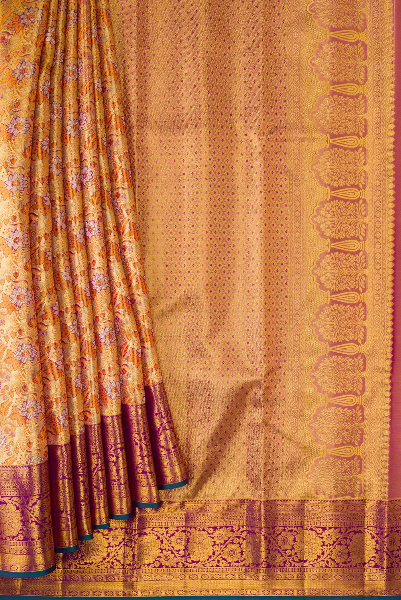 Pleats and pallu of Gold Dual Tone Kanjivaram Tissue Silk Saree with Zari Brocade on the body and Zari Border. 