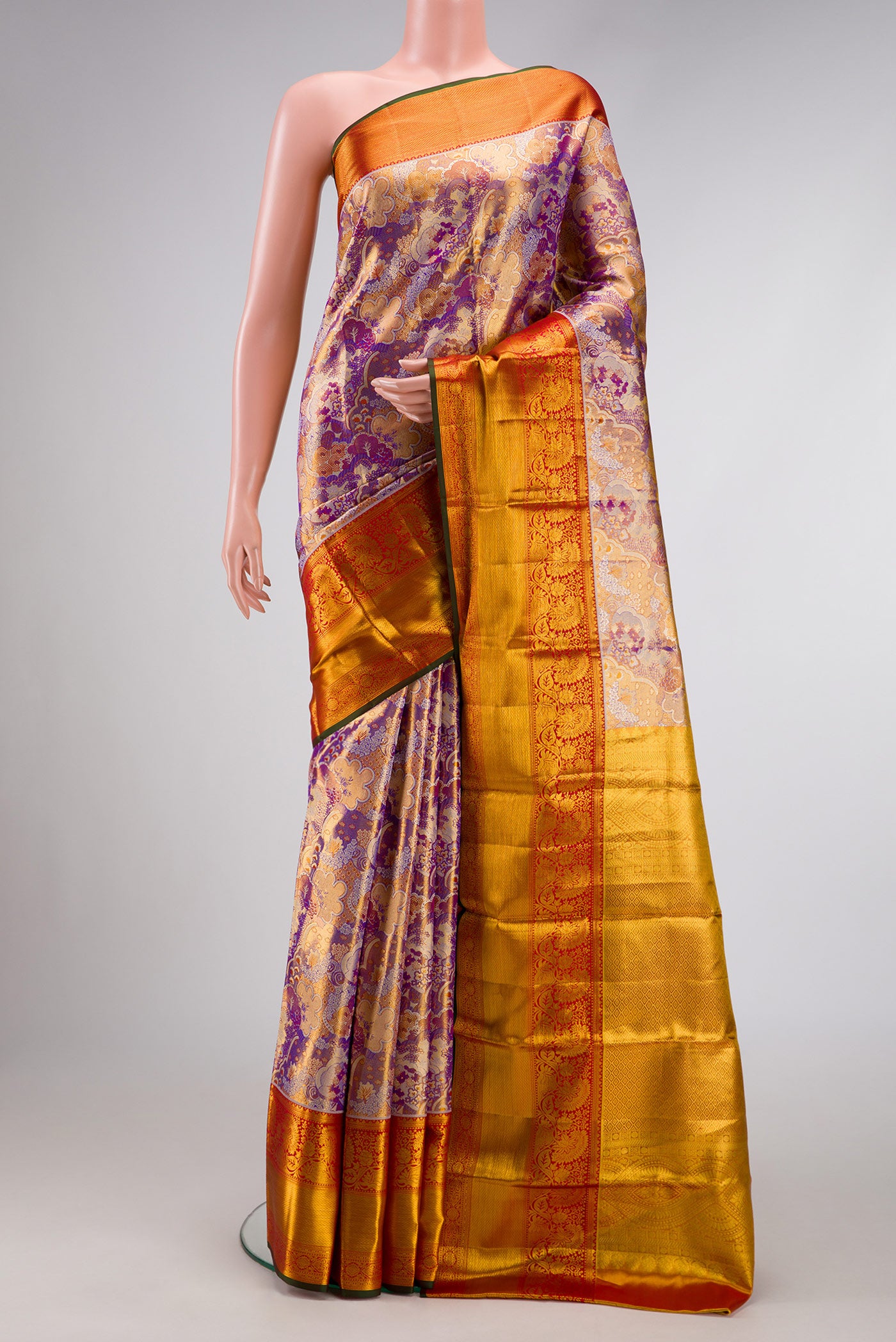 Lavender Dual Tone Kanjivaram Tissue Silk Saree with Zari Brocade on the body and Zari Border.  displayed on a mannequin