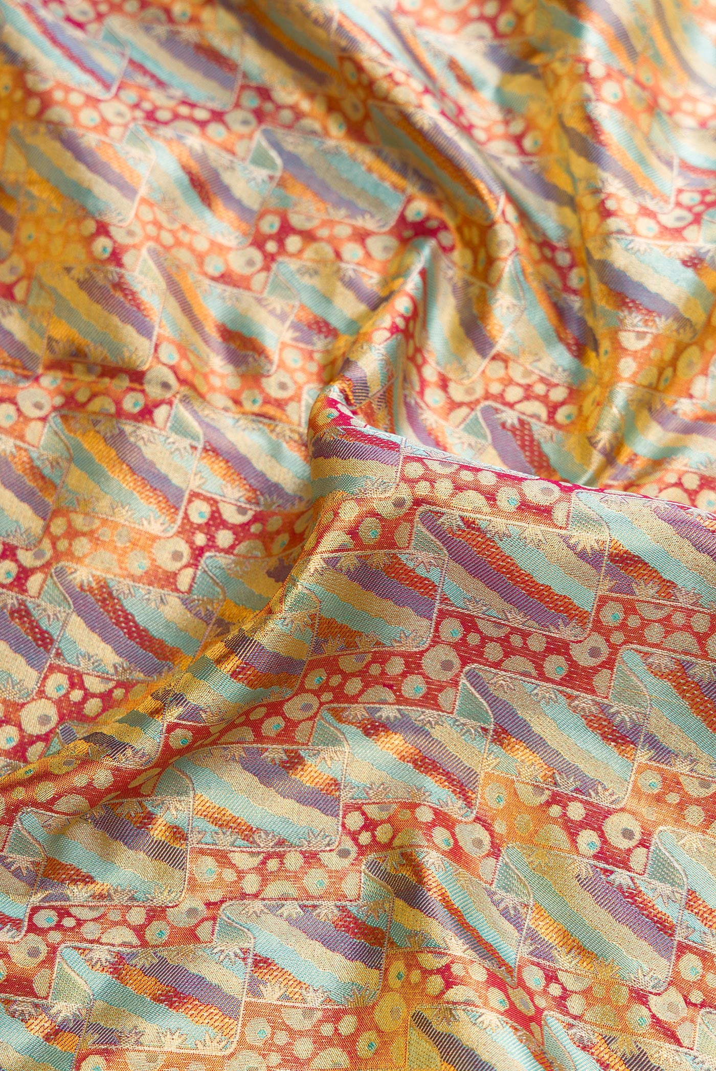 Close up of Sky Blue Dual Tone Kanjivaram Tissue Silk Saree with Zari Brocade on the body and Zari Border.  displaying folds