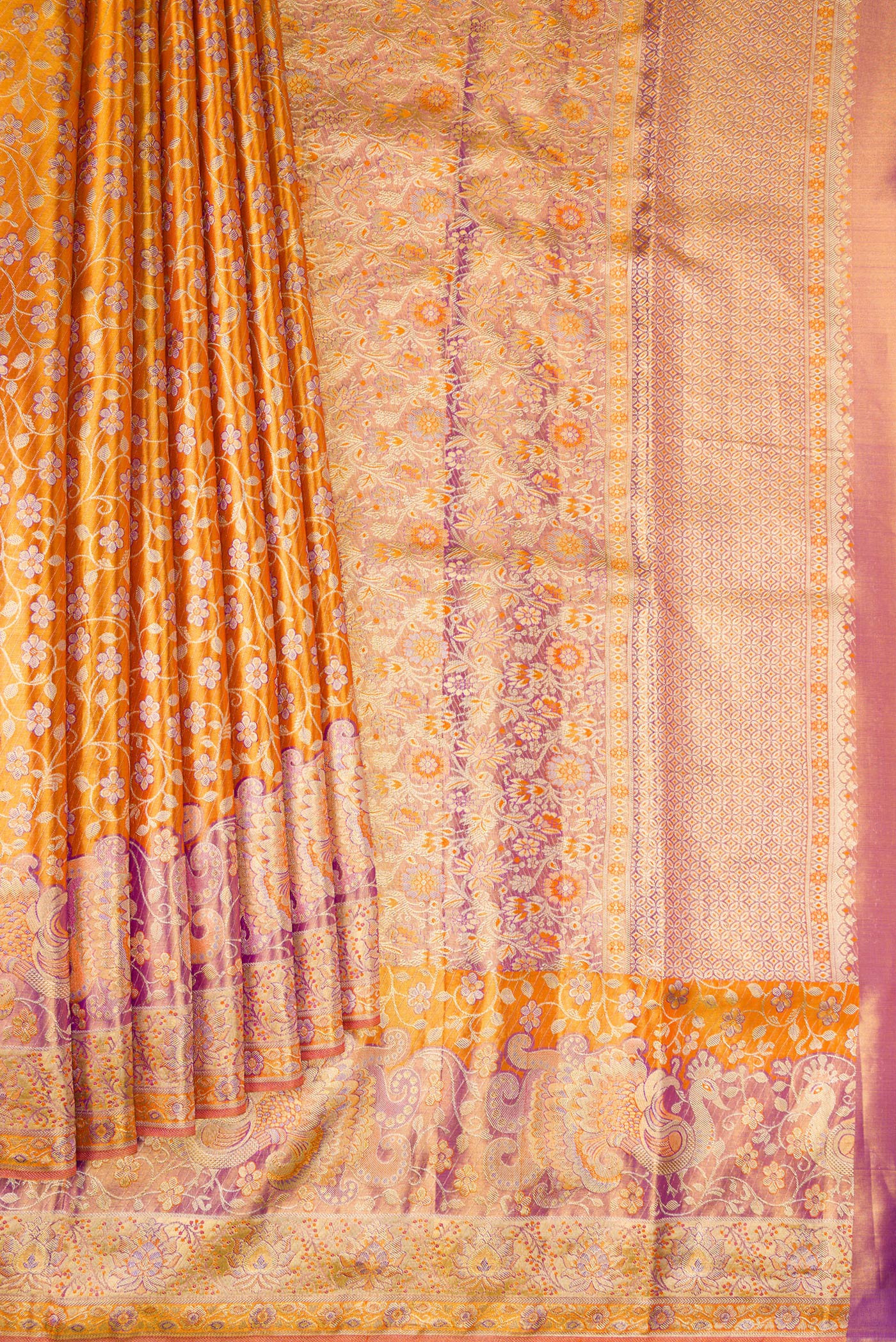 Pleats and pallu of Golden Peach Dual Tone Kanjivaram Tissue Silk Saree with Zari Brocade on the body and Fancy Border. 