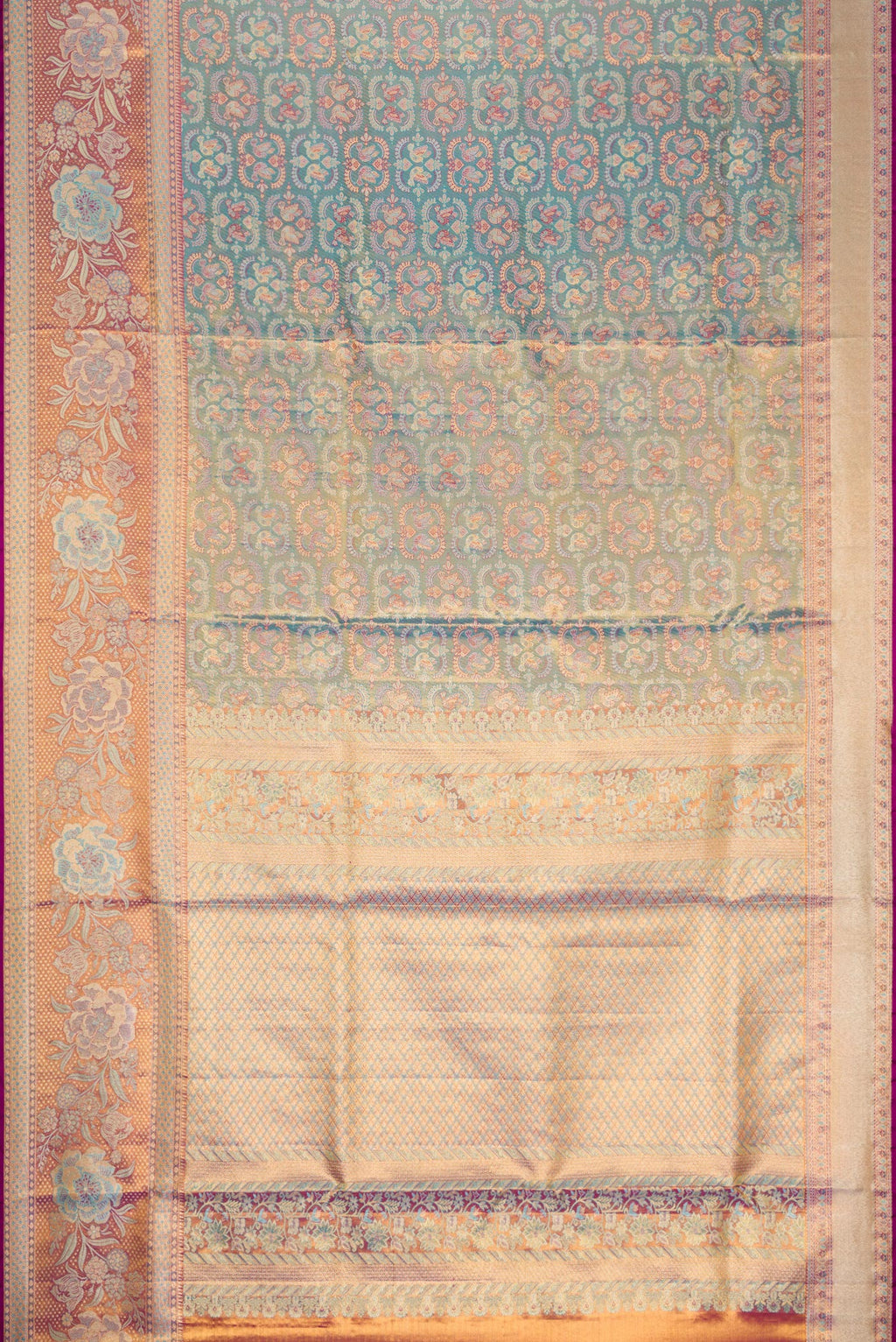 Flat view of Light Blue Dual Tone Kanjivaram Tissue Silk Saree with Zari Brocade on the body and Fancy Border. 