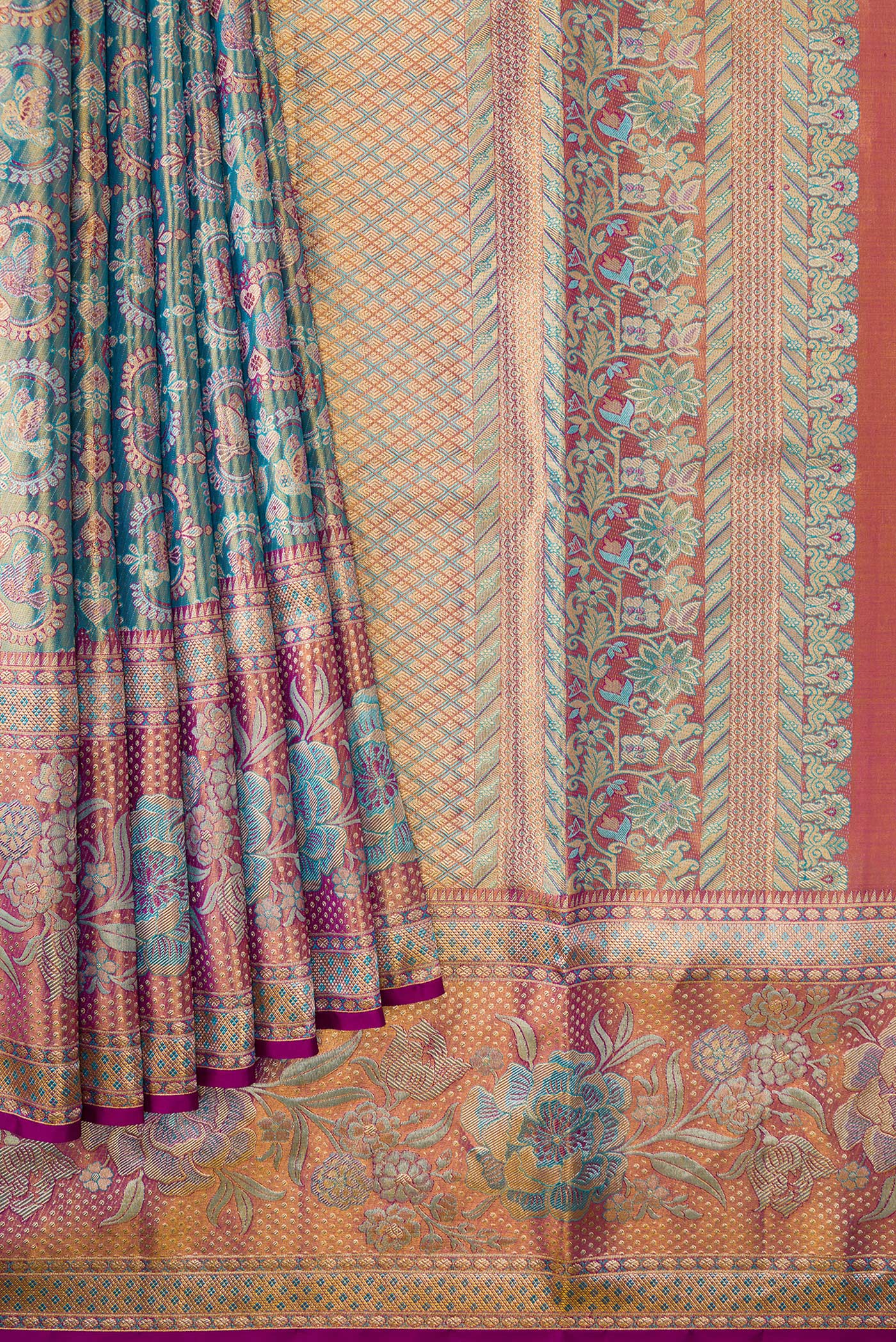 Pleats and pallu of Light Blue Dual Tone Kanjivaram Tissue Silk Saree with Zari Brocade on the body and Fancy Border. 