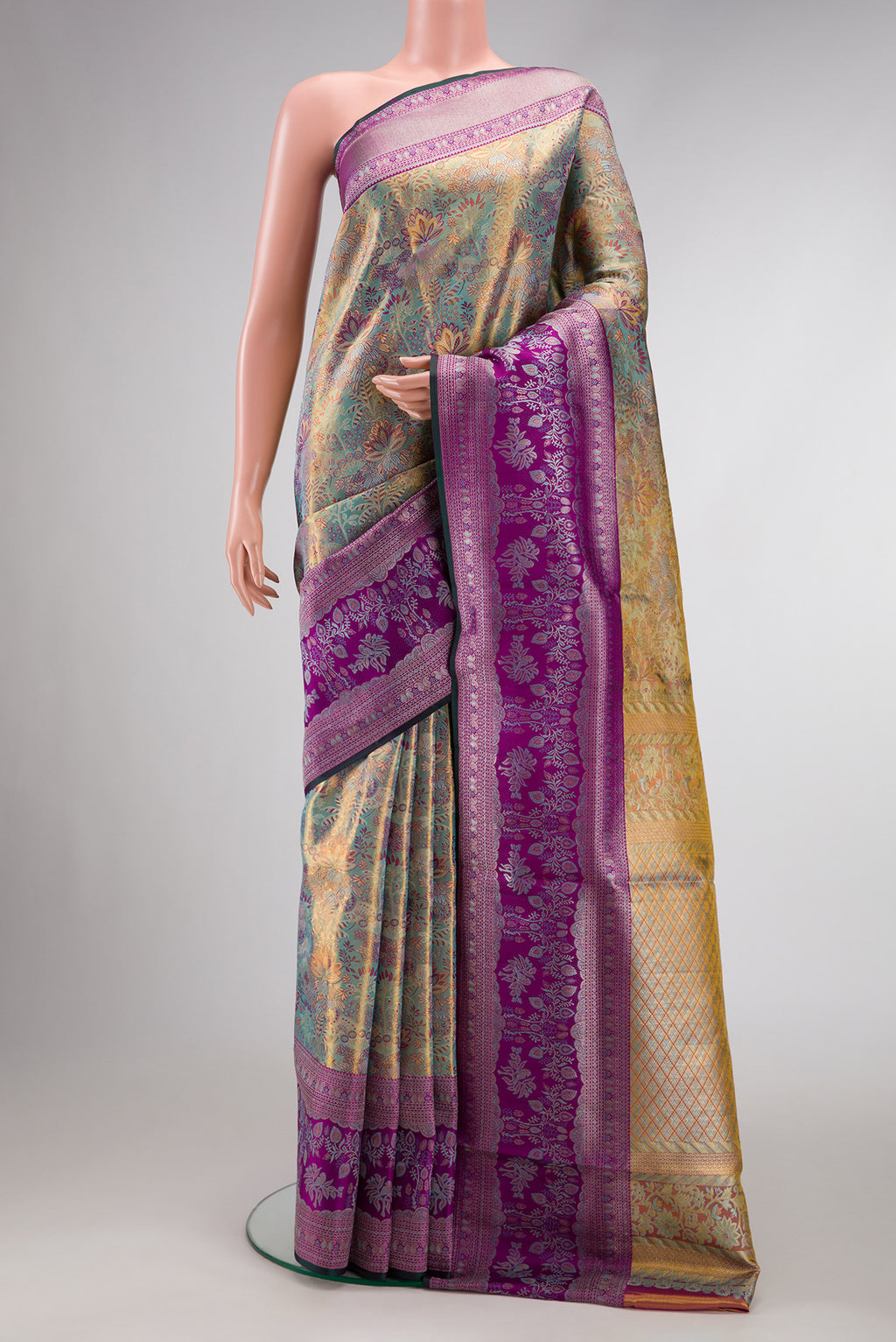 Gold Dual Tone Kanjivaram Tissue Silk Saree with Zari Brocade on the body and Zari Border.  displayed on a mannequin