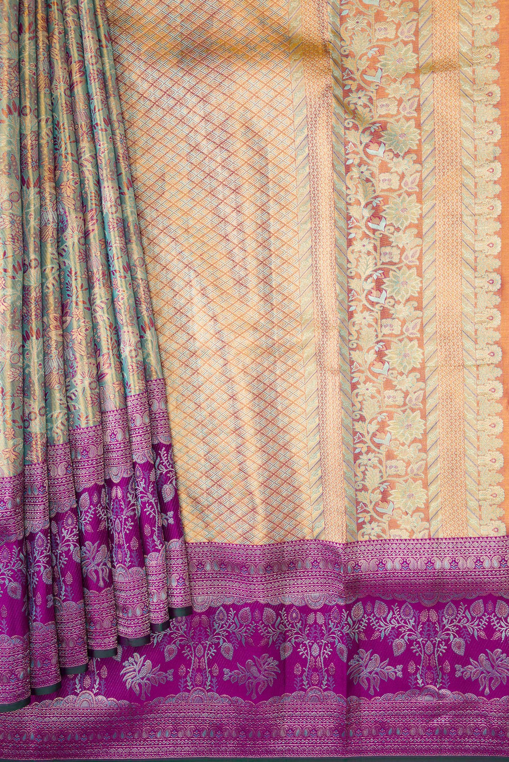Pleats and pallu of Gold Dual Tone Kanjivaram Tissue Silk Saree with Zari Brocade on the body and Zari Border. 