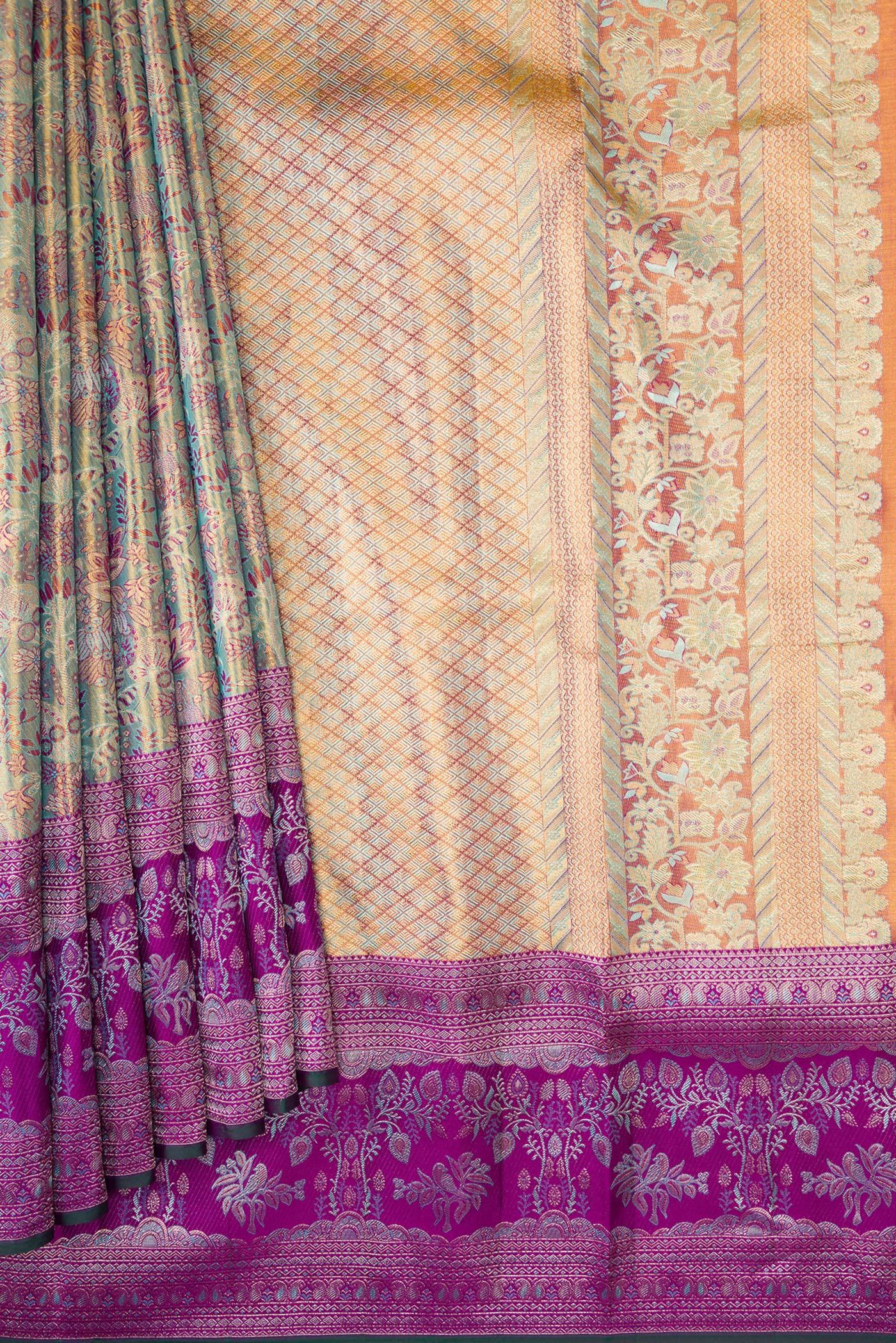 Pleats and pallu of Gold Dual Tone Kanjivaram Tissue Silk Saree with Zari Brocade on the body and Zari Border. 