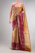 Gold Dual Tone Kanjivaram Tissue Silk Saree with Zari Brocade on the body and Zari Border.  displayed on a mannequin