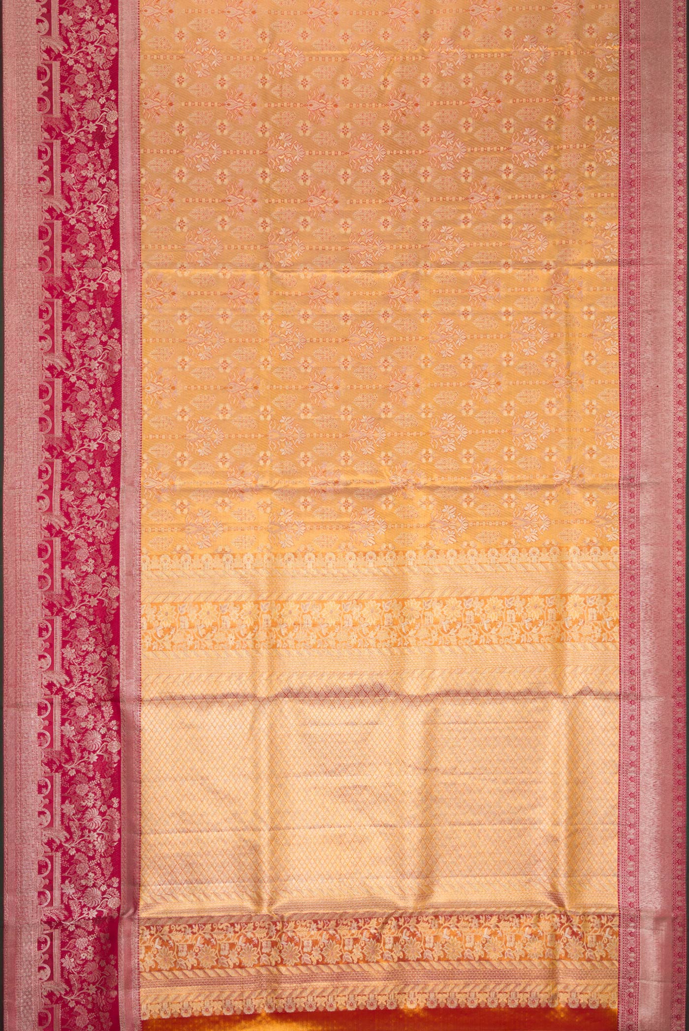 Flat view of Gold Dual Tone Kanjivaram Tissue Silk Saree with Zari Brocade on the body and Zari Border. 