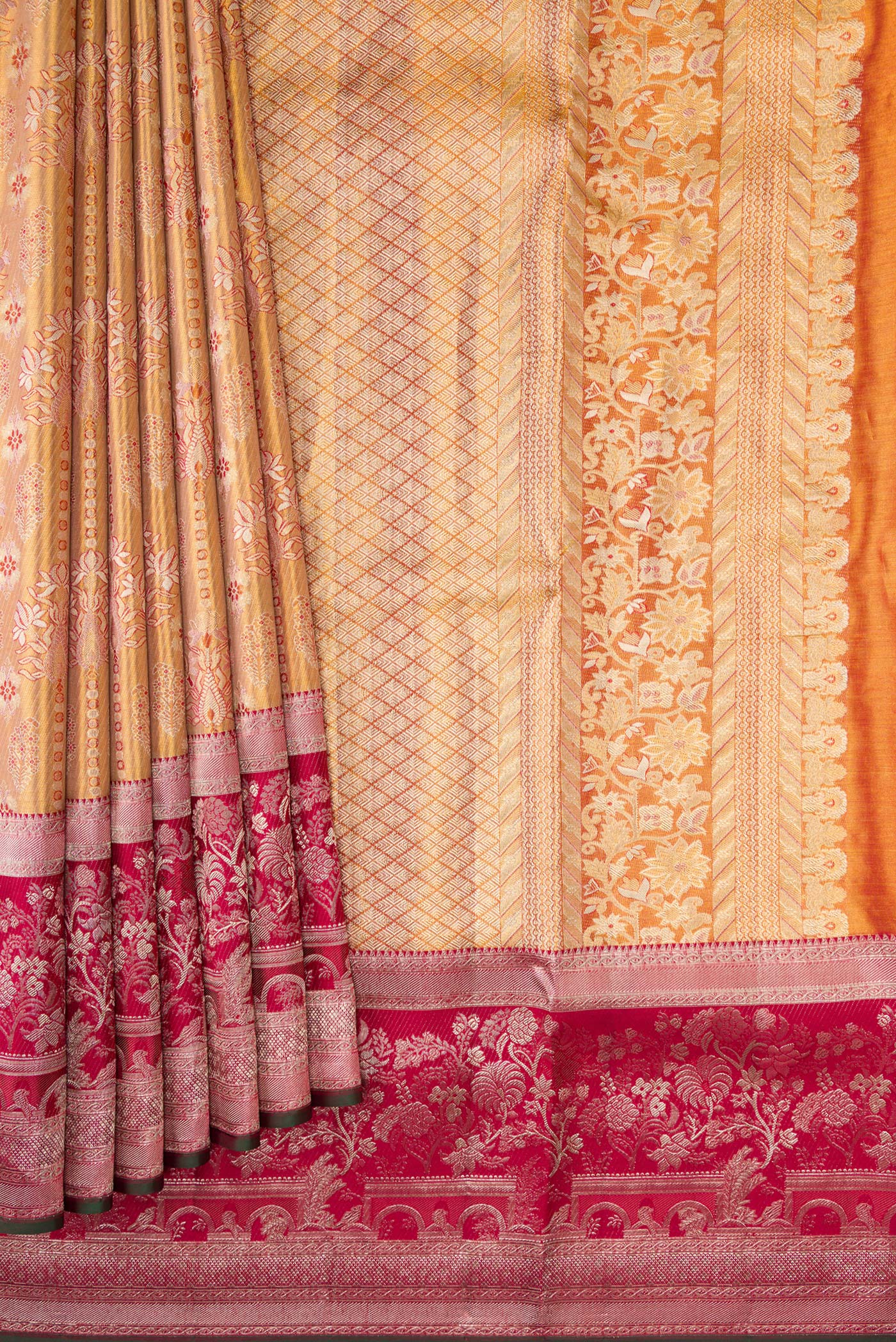 Pleats and pallu of Gold Dual Tone Kanjivaram Tissue Silk Saree with Zari Brocade on the body and Zari Border. 