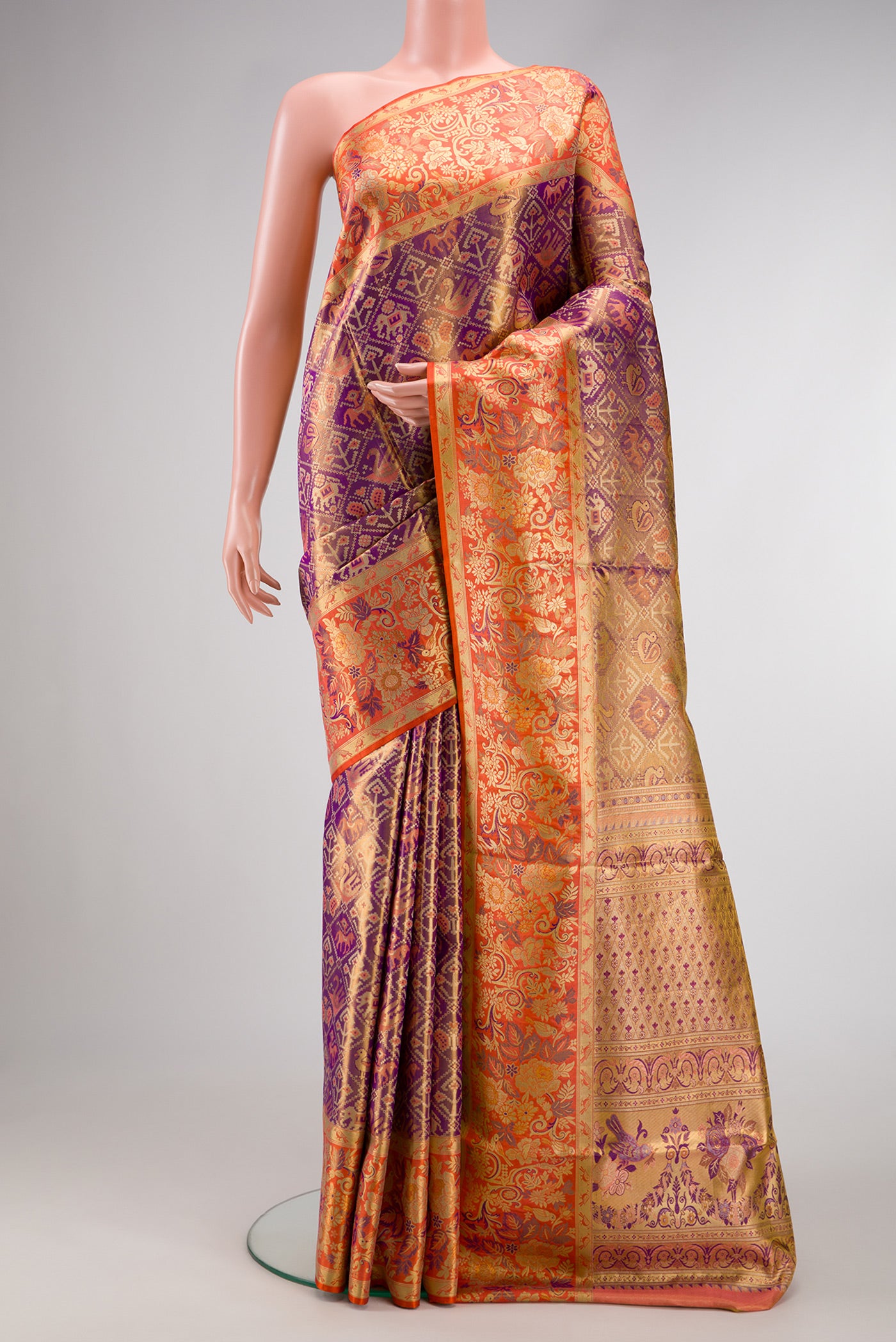 Lavender Dual Tone Kanjivaram Tissue Silk Saree with Zari Brocade on the body and Zari Border.  displayed on a mannequin