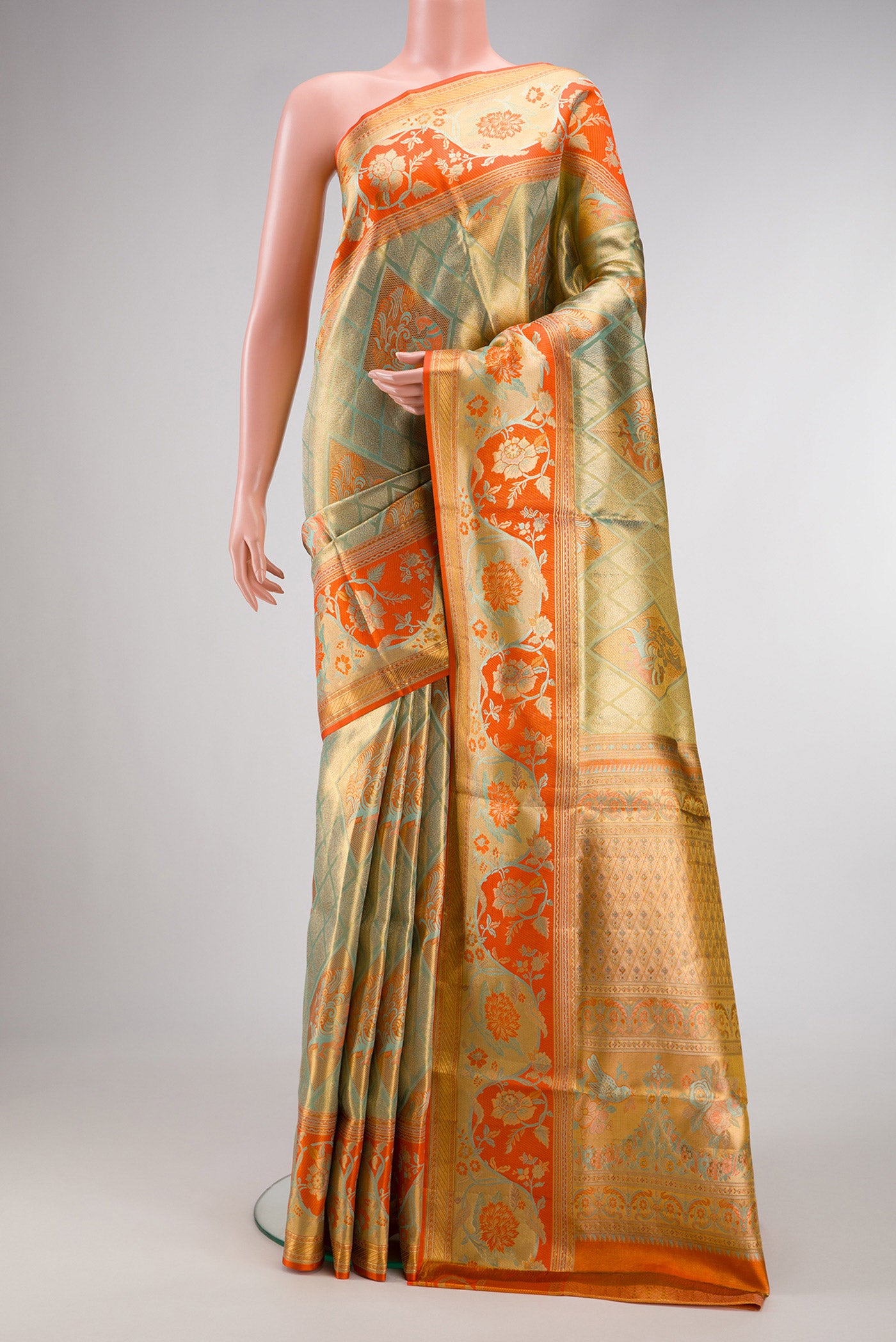 Light Green Dual Tone Kanjivaram Tissue Silk Saree with Zari Brocade on the body and Zari Border.  displayed on a mannequin