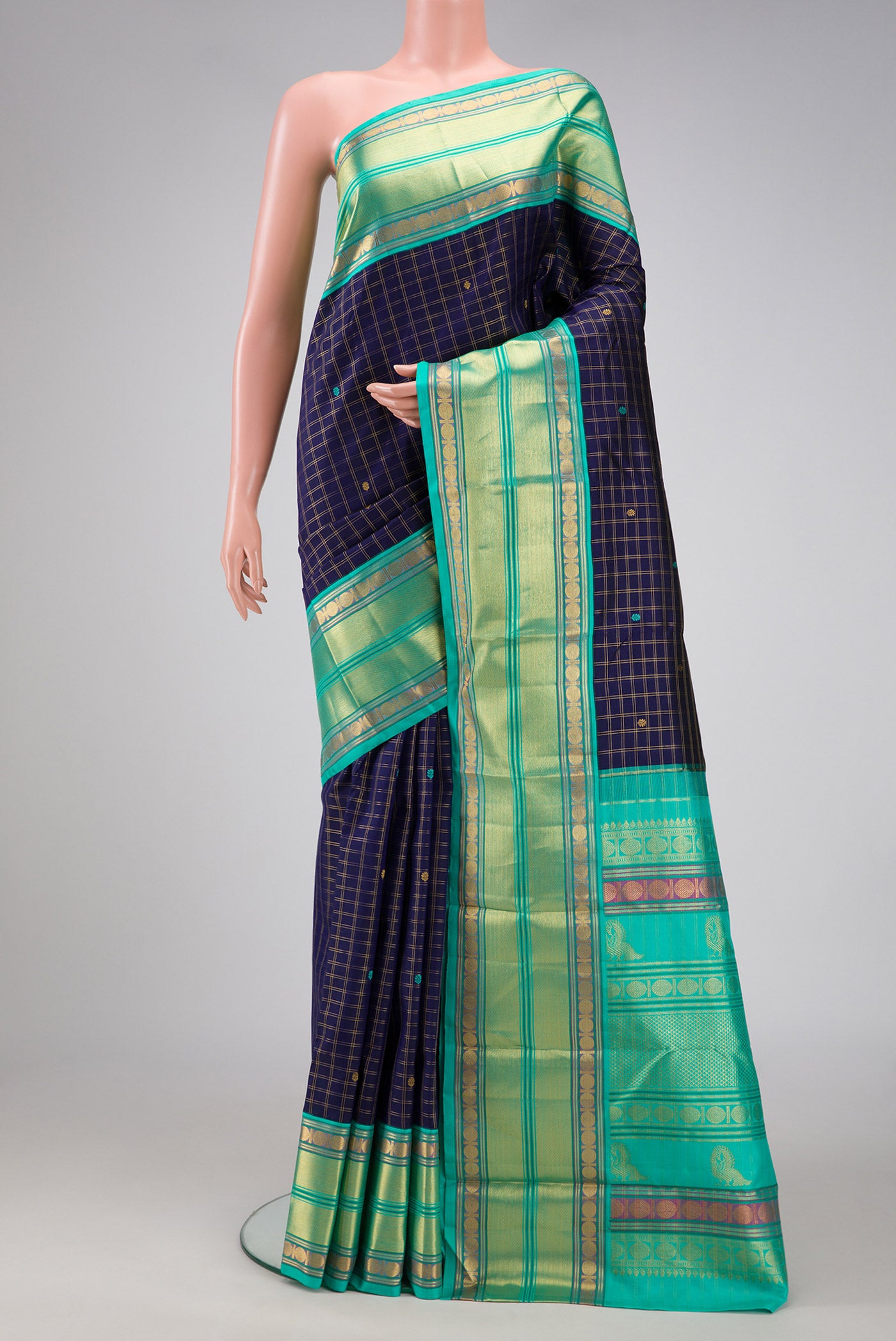Royal Blue Dual Tone Kanjivaram Silk Saree with Zari Butta on the body and Zari Border.  displayed on a mannequin