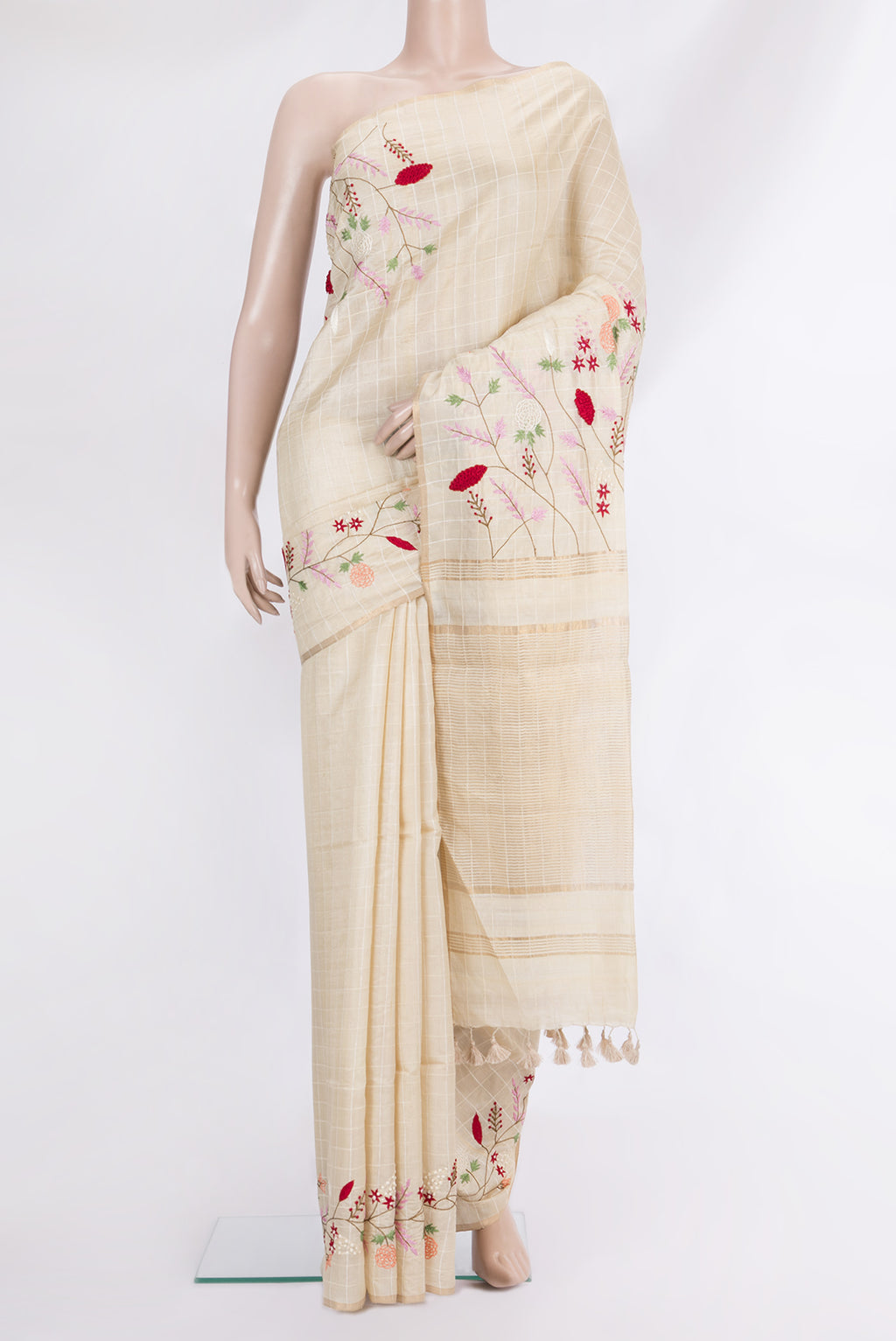 Beige Tussar Saree with Checked design on the body and Embroidered Border.  displayed on a mannequin