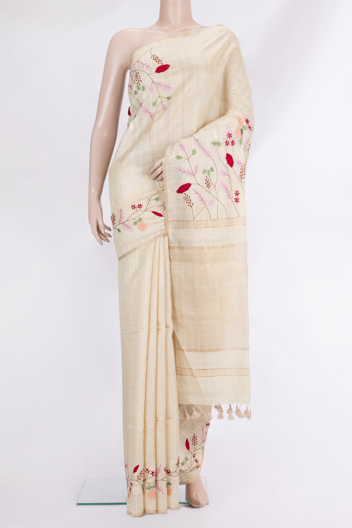 Beige Tussar Saree with Checked design on the body and Embroidered Border.  displayed on a mannequin