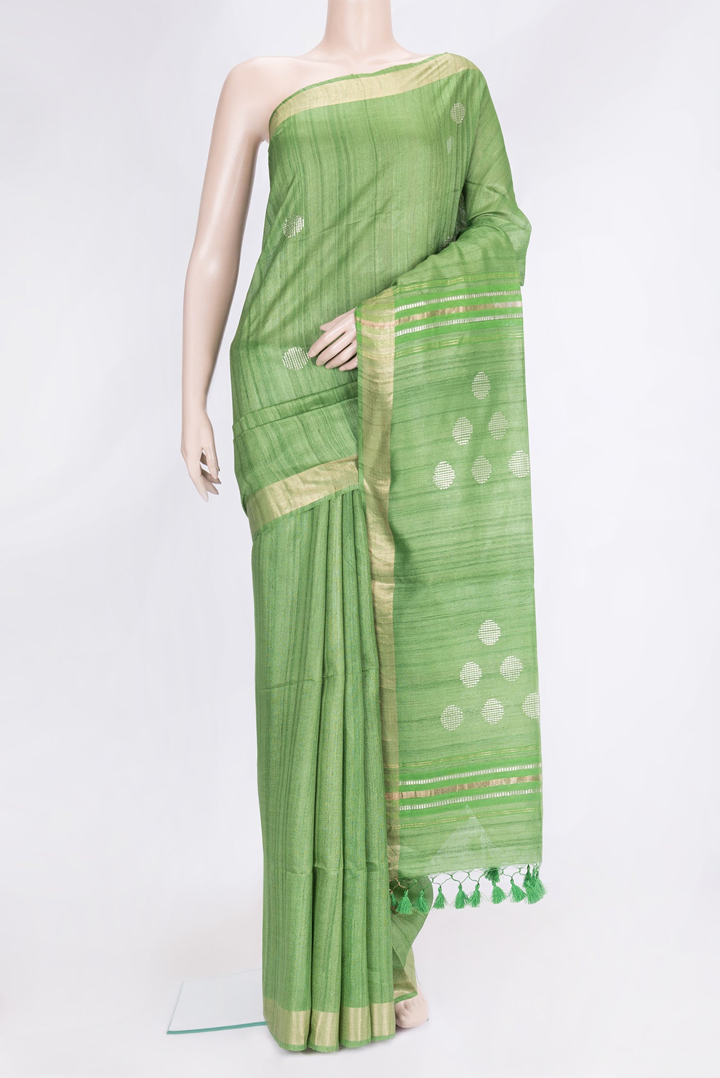 Parrot Green Dual Tone Tussar Silk Saree with Zari Butta on the body and Zari Border.  displayed on a mannequin
