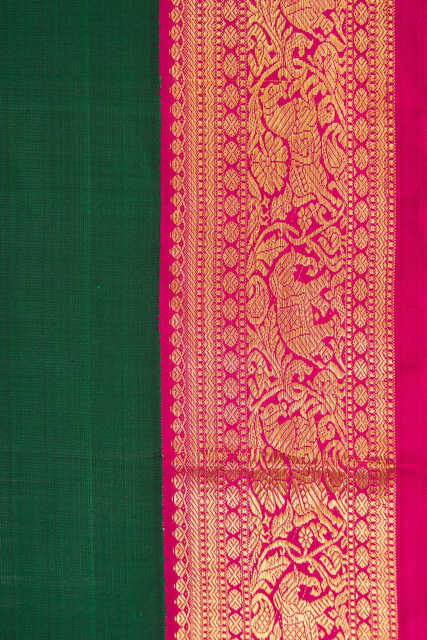 Border image of Bottle Green Dual Tone Kanjivaram Silk Saree with Plain Body and Zari Border. 