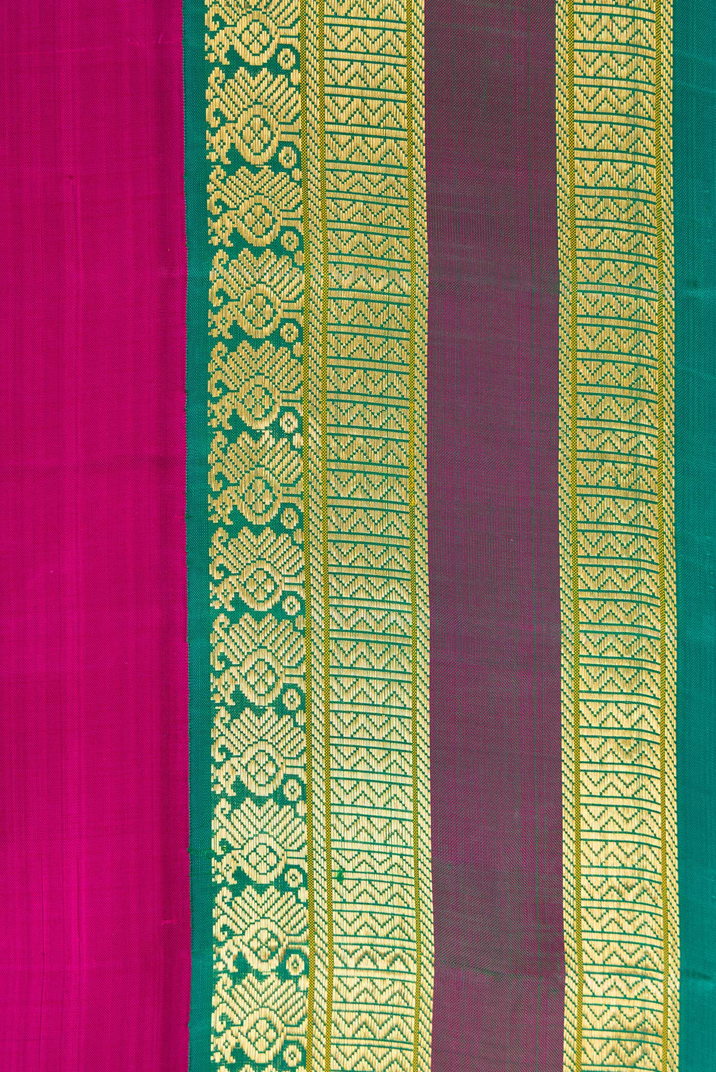 Border image of Magenta Dual Tone Kanjivaram Silk Saree with Plain Body and Zari Border. 