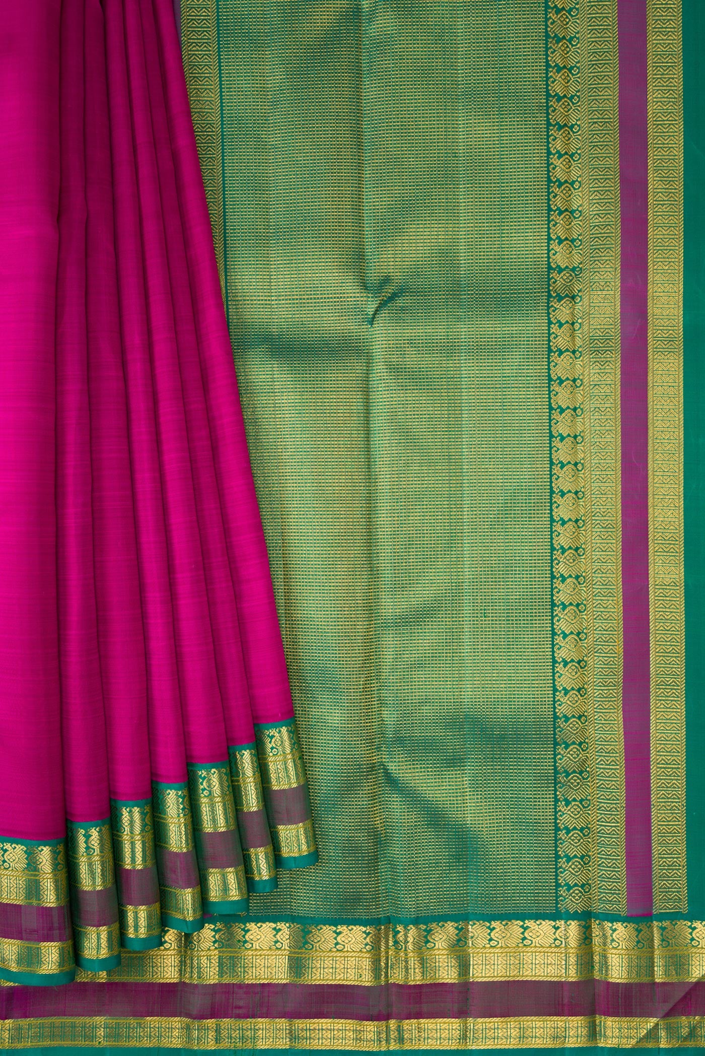 Pleats and pallu of Magenta Dual Tone Kanjivaram Silk Saree with Plain Body and Zari Border. 