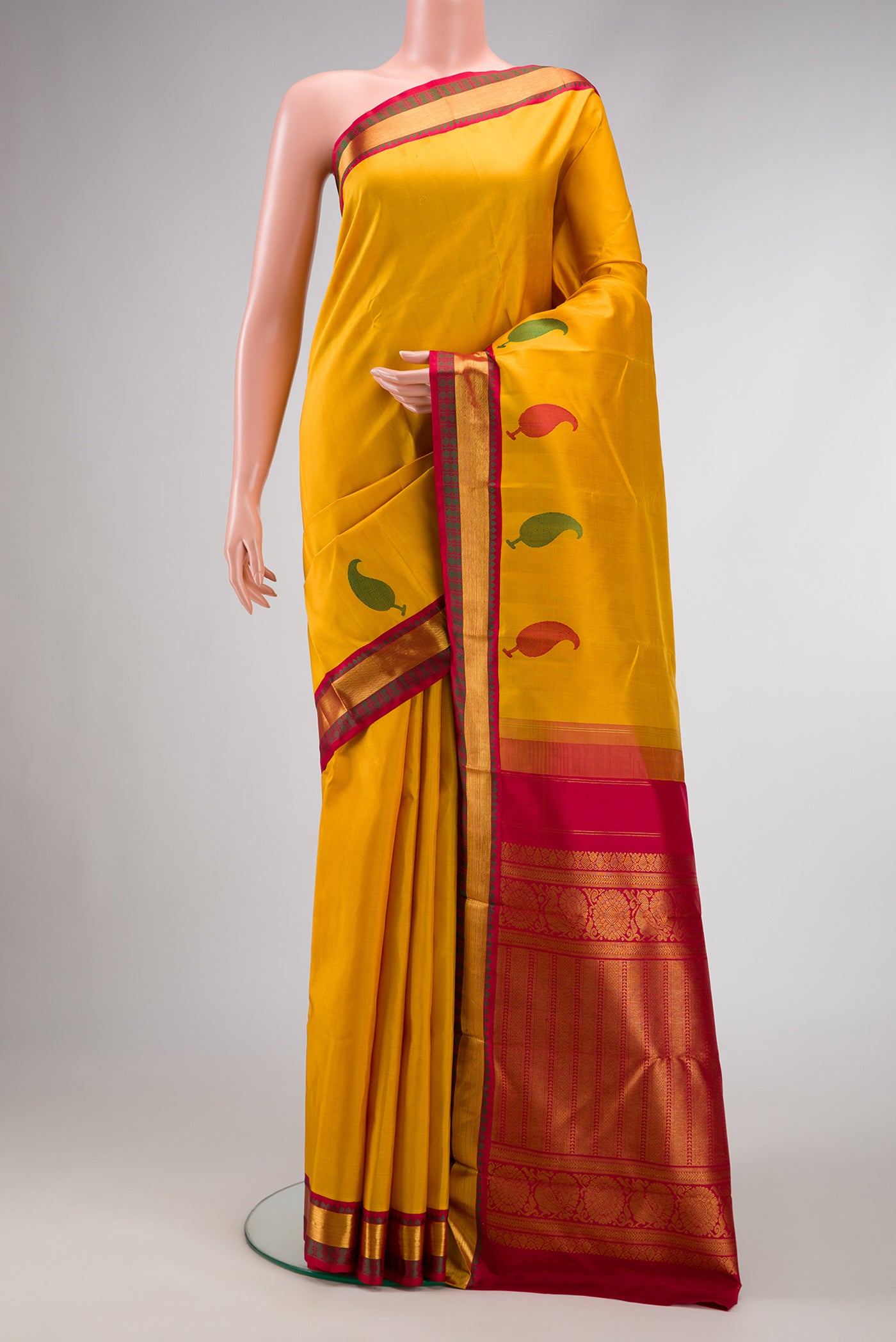 Pure Silk Pure Zari Mustard Dual Tone Kanjivaram Saree with Plain Body and Fancy Border.  displayed on a mannequin