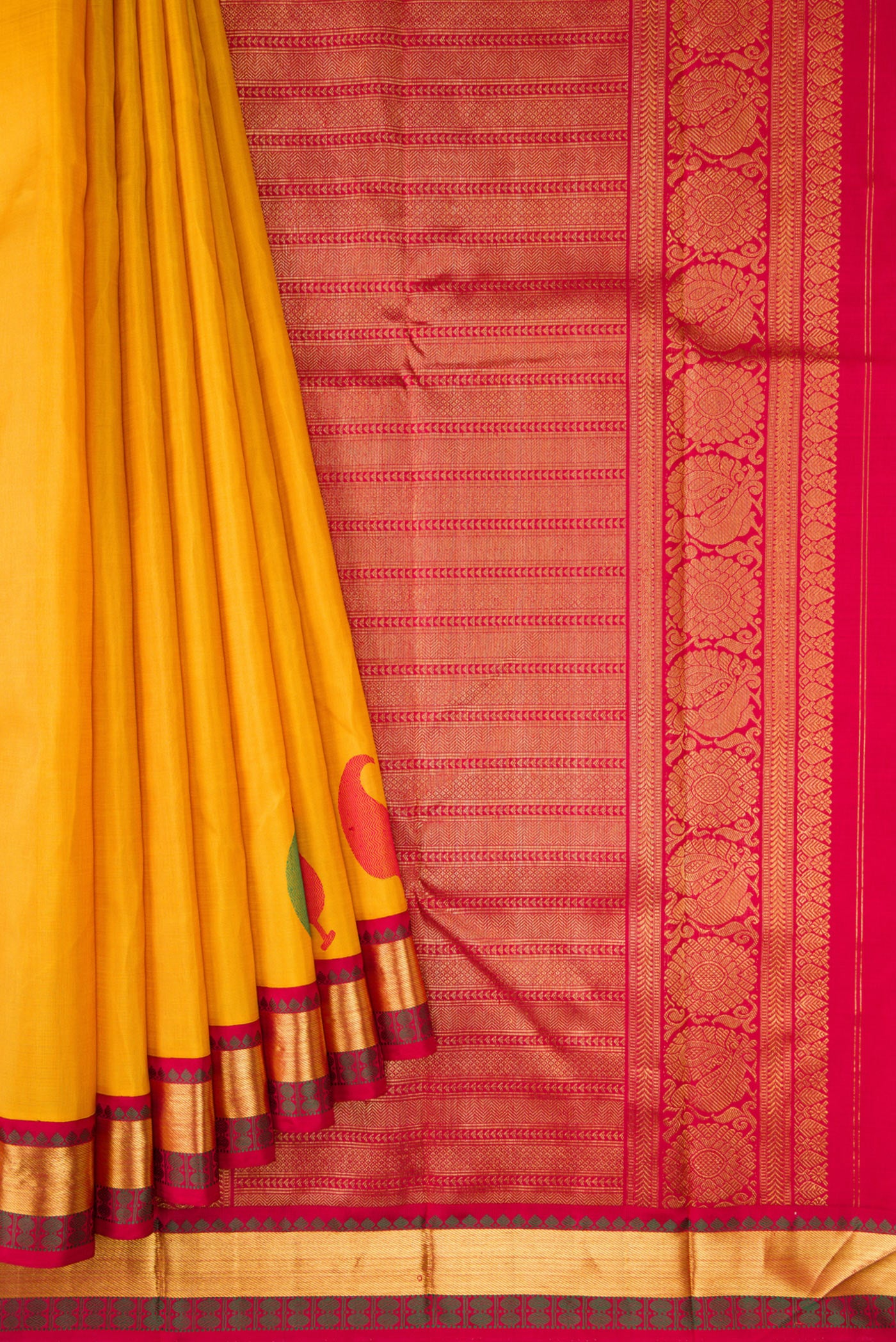 Pleats and pallu of Pure Silk Pure Zari Mustard Dual Tone Kanjivaram Saree with Plain Body and Fancy Border. 