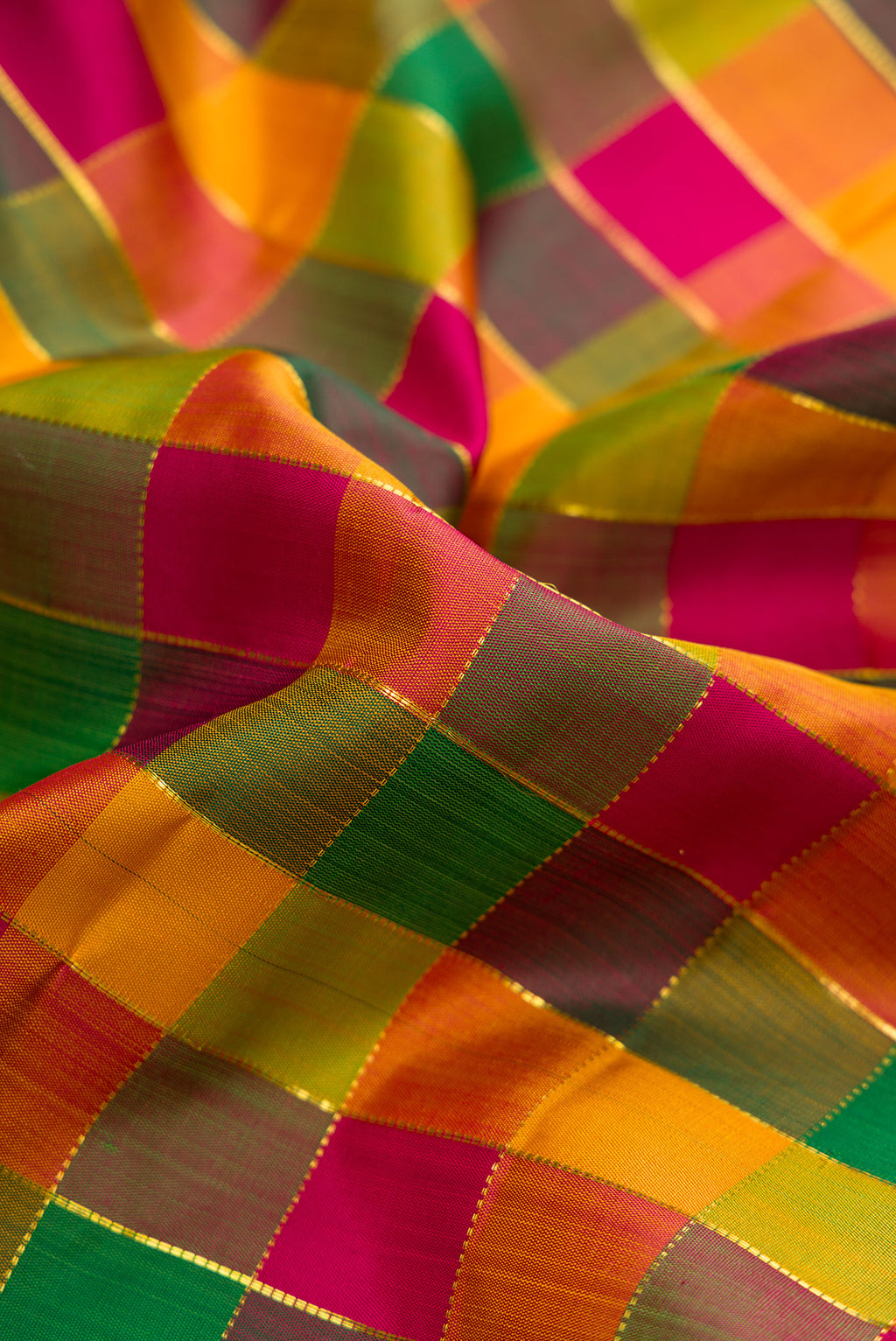 Close up of Pure Silk Pure Zari Maroon, Bottle Green and Musturd Color Kanchipuram Nine Yards Saree with Checked design on the body and Zari Border.  displaying folds
