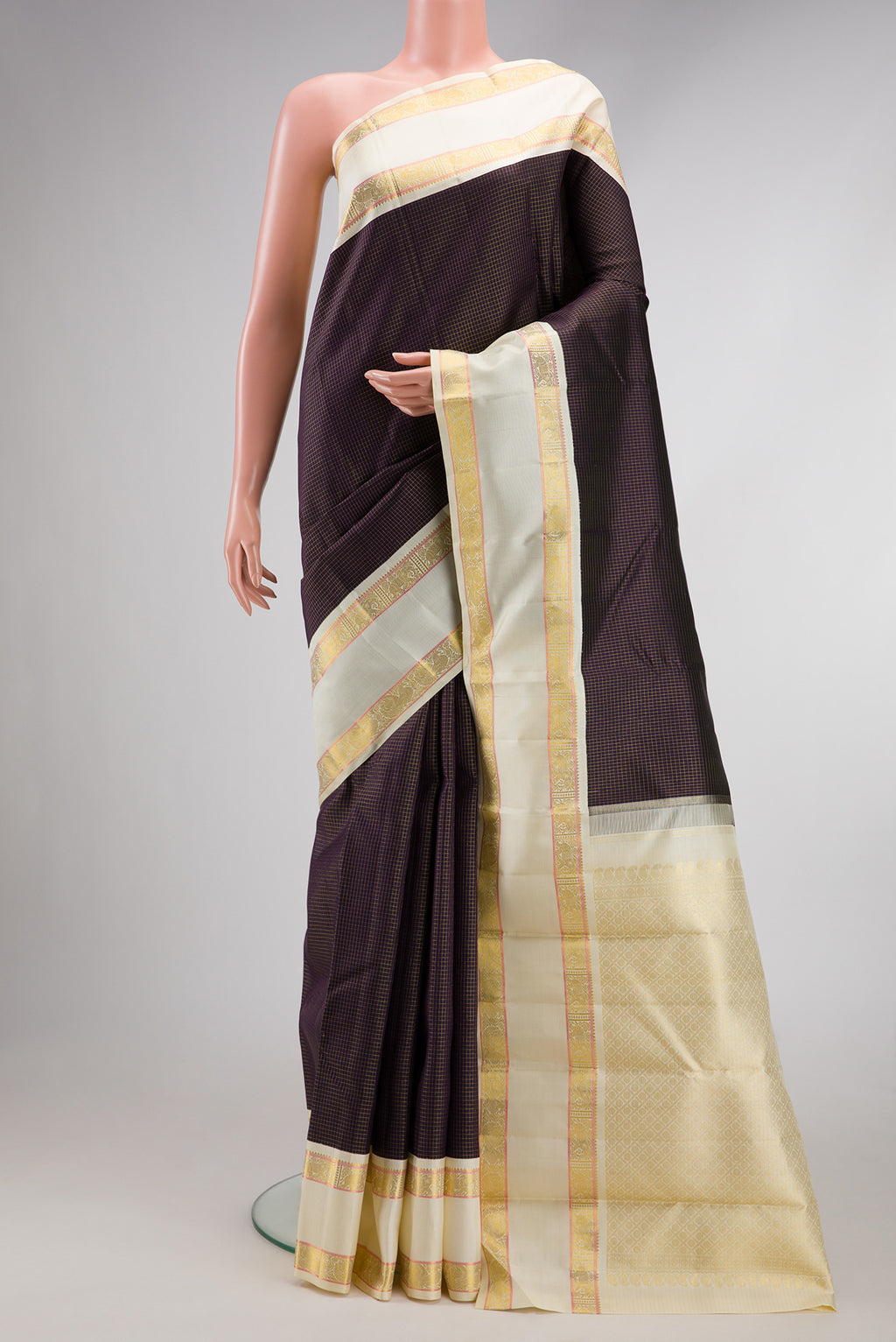 Pure Silk Pure Zari Burgundy Dual Tone Kanjivaram Saree with Checked design on the body and Zari Border.  displayed on a mannequin
