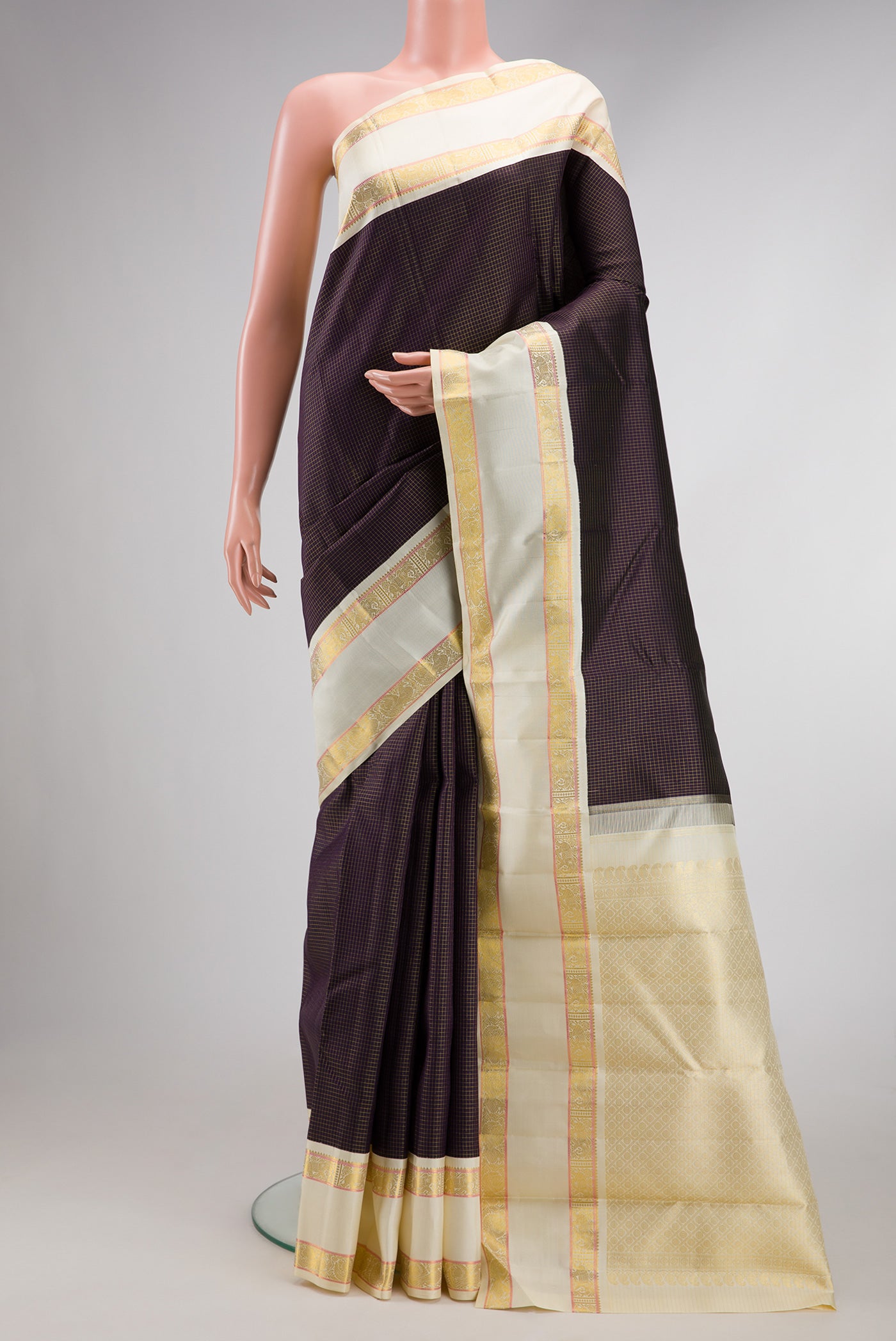 Pure Silk Pure Zari Burgundy Dual Tone Kanjivaram Saree with Checked design on the body and Zari Border.  displayed on a mannequin