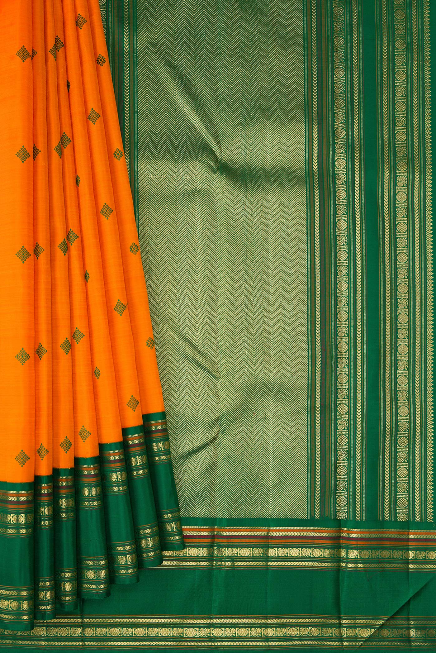 Pleats and pallu of Pure Silk Pure Zari Orange Dual Tone Kanchipuram Saree with Thread Butta on the body and Zari Border. 