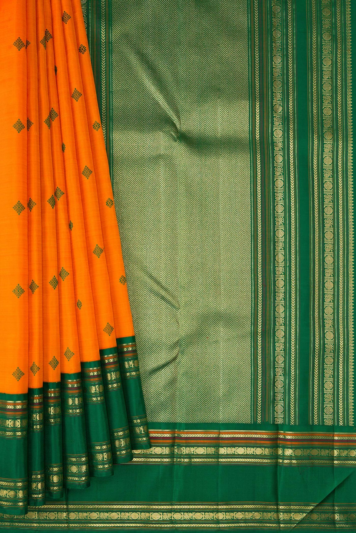 Pleats and pallu of Pure Silk Pure Zari Orange Dual Tone Kanchipuram Saree with Thread Butta on the body and Zari Border. 