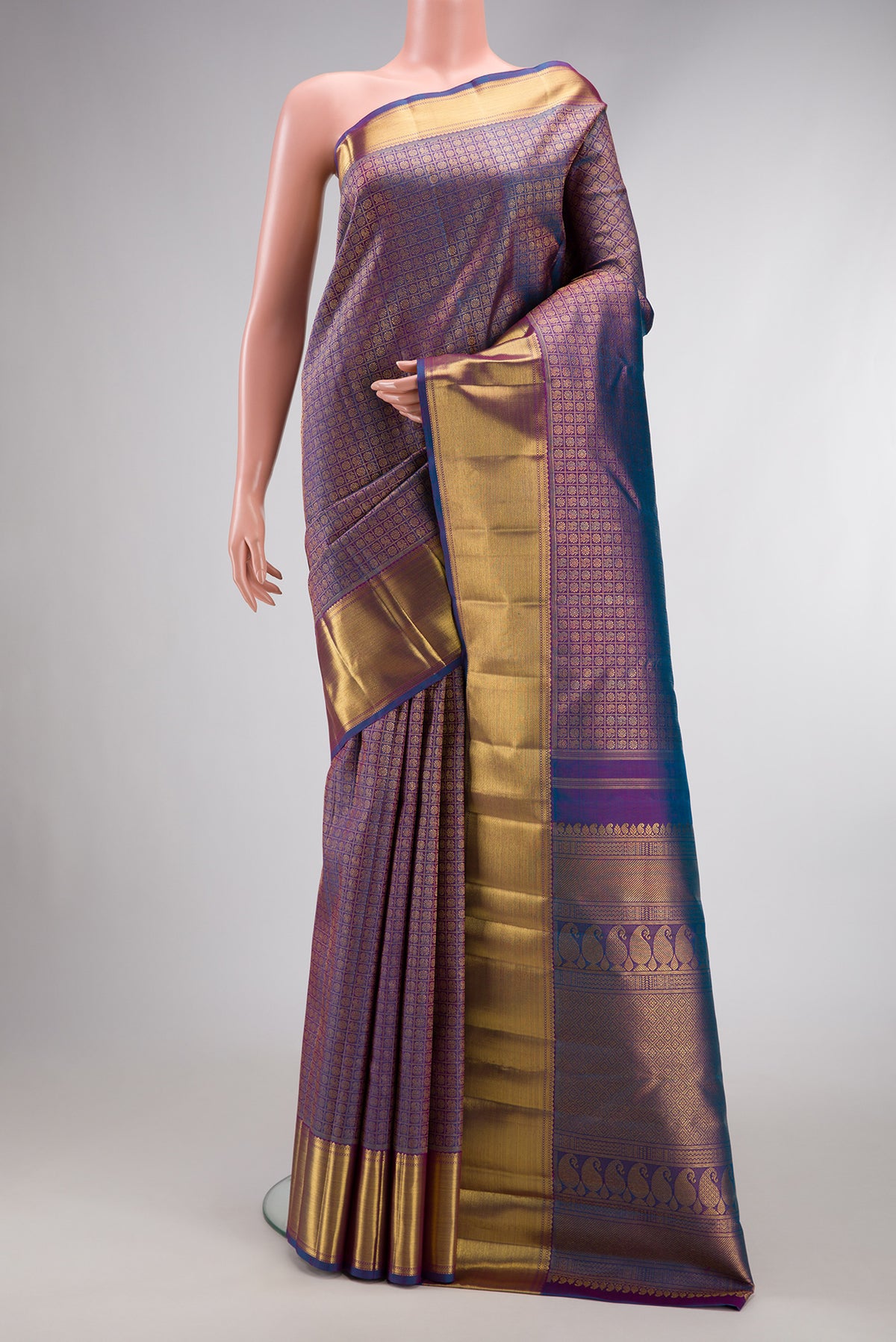 Pure Silk Pure Zari Peacock Blue Dual Tone Kanjivaram Saree with Zari Brocade on the body and Zari Border.  displayed on a mannequin