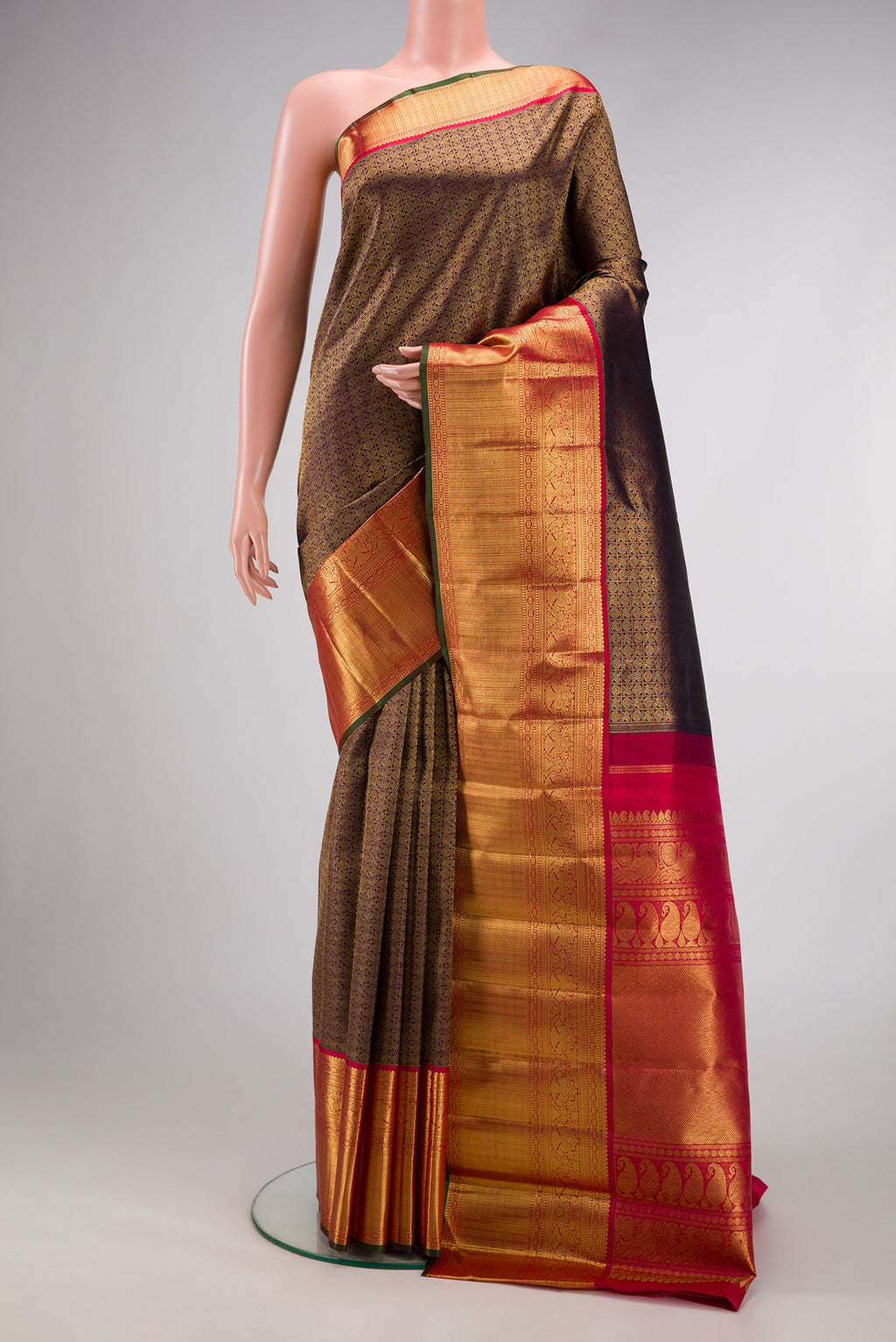 Pure Silk Pure Zari Burgundy Dual Tone Kanjivaram Saree with Zari Brocade on the body and Zari Border.  displayed on a mannequin