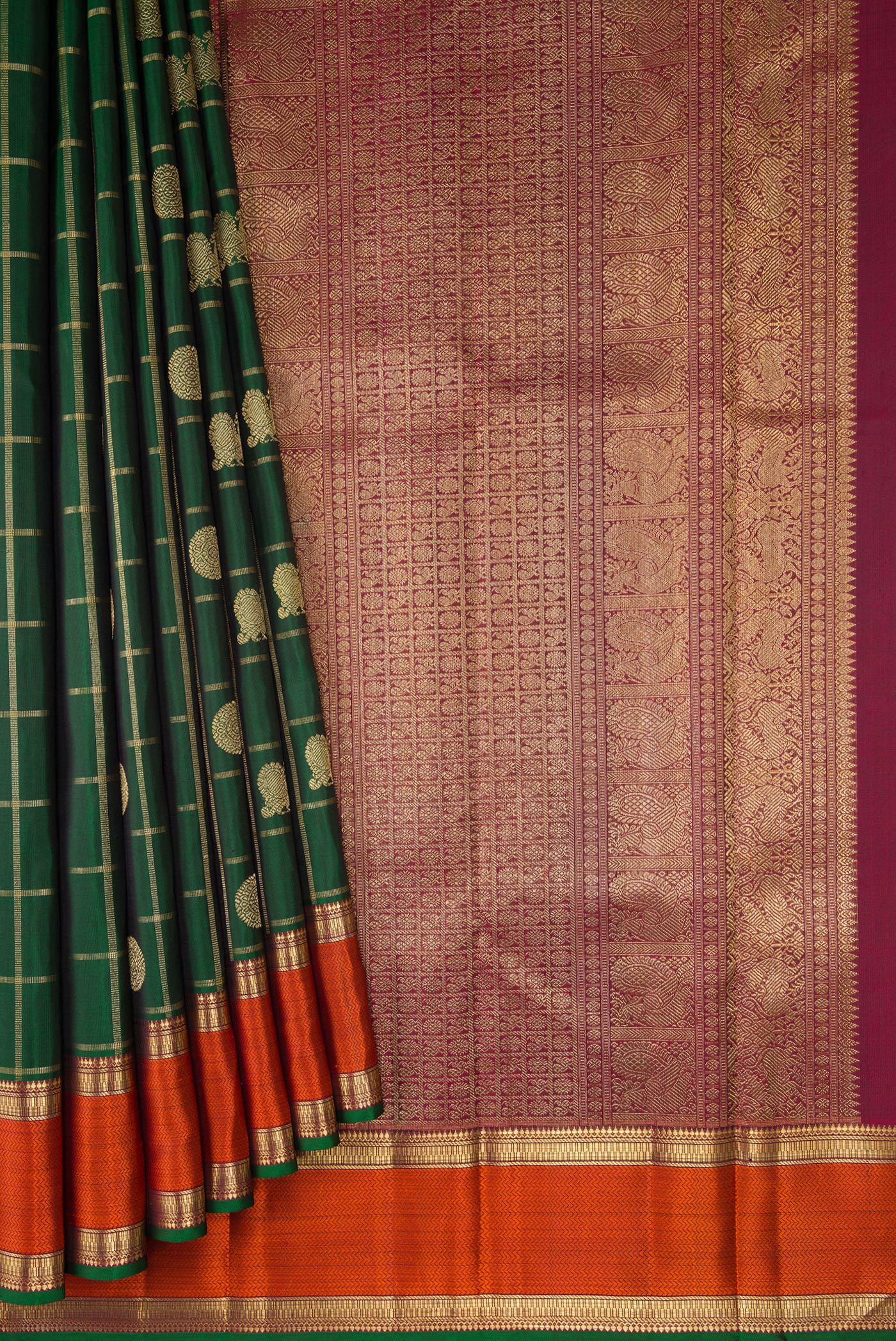 Pleats and pallu of Pure Silk Pure Zari Bottle Green Dual Tone Kanjivaram Saree with Checked design on the body and Zari And Thread Border. 