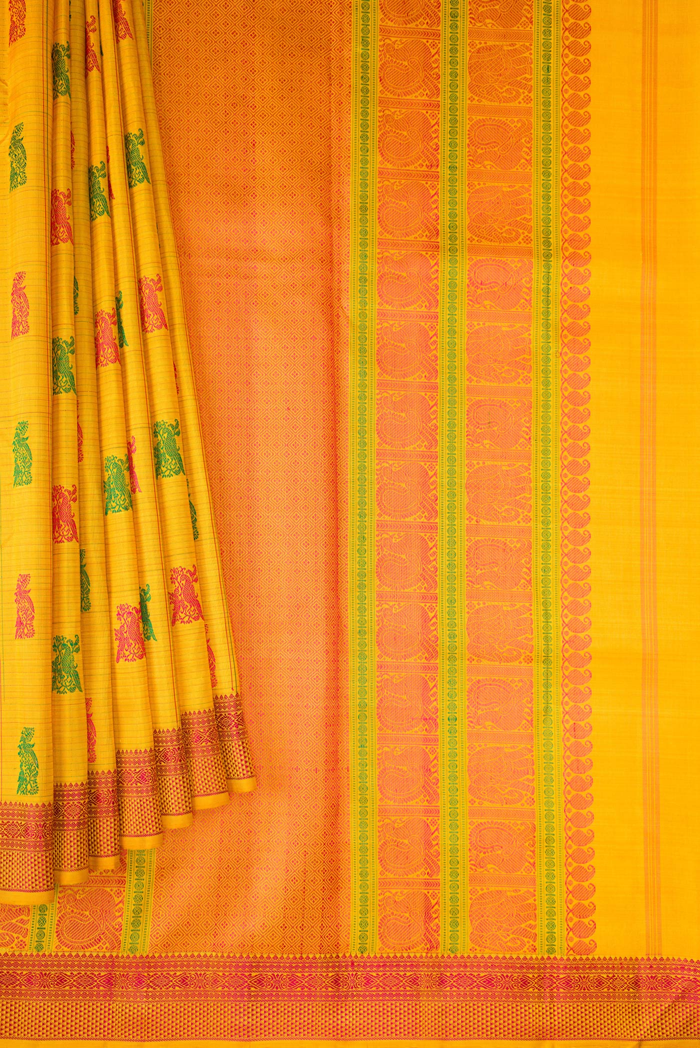 Pleats and pallu of Mustard Dual Tone Kanchipuram Silk Saree with Stripes on the body and Fancy Border. 