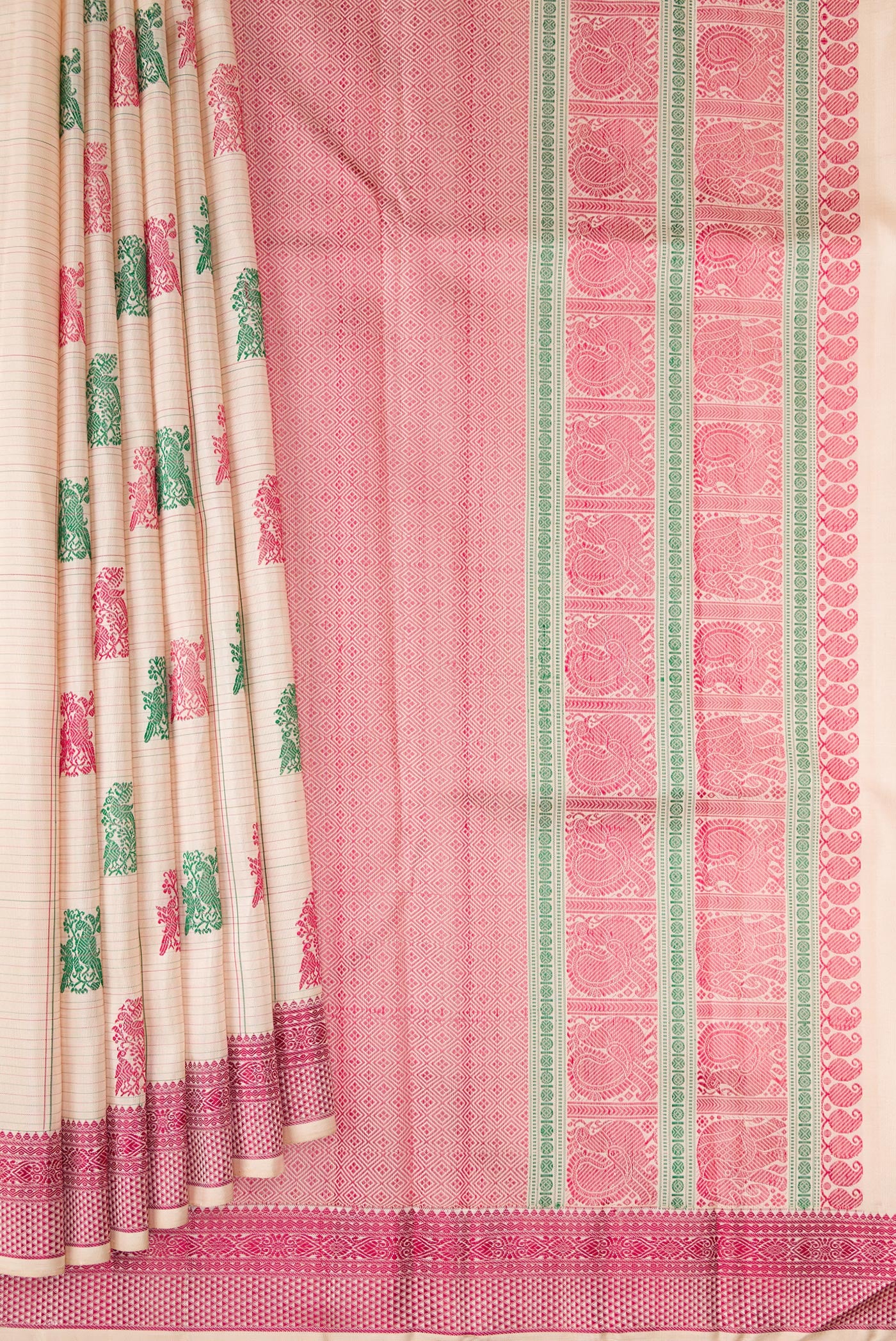 Pleats and pallu of Beige Dual Tone Kanchipuram Silk Saree with Stripes on the body and Fancy Border. 