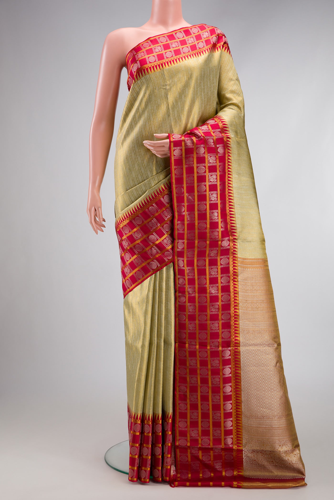 Pista Green Dual Tone Kanjivaram Tissue Silk Saree with Zari Brocade on the body and Zari Border.  displayed on a mannequin